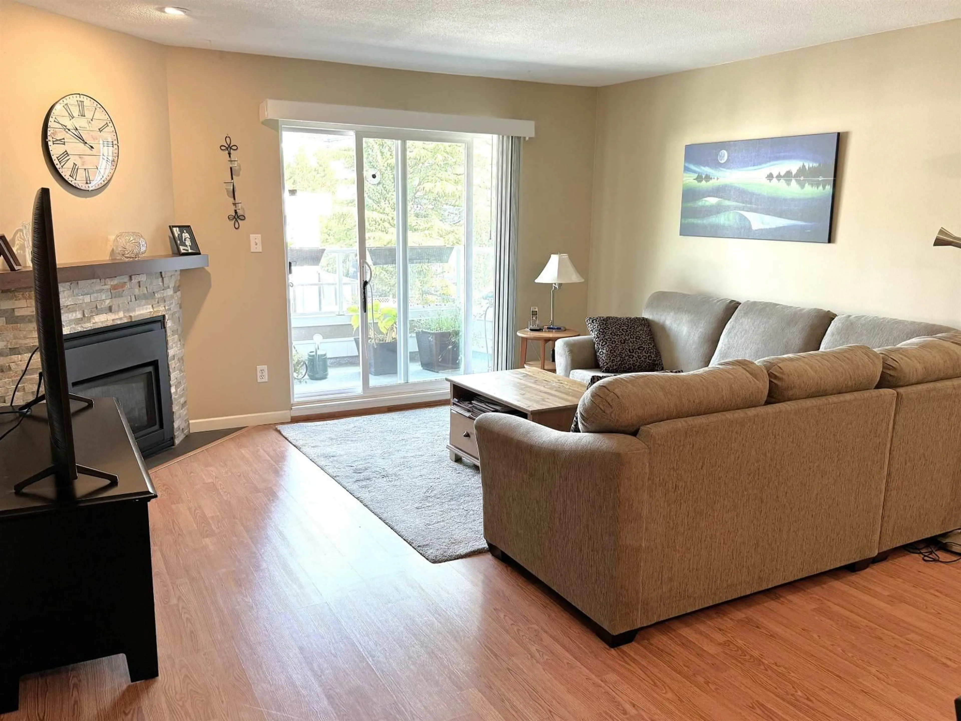Living room with furniture, wood/laminate floor for 317 - 15875 MARINE DRIVE, White Rock British Columbia V4B5J2