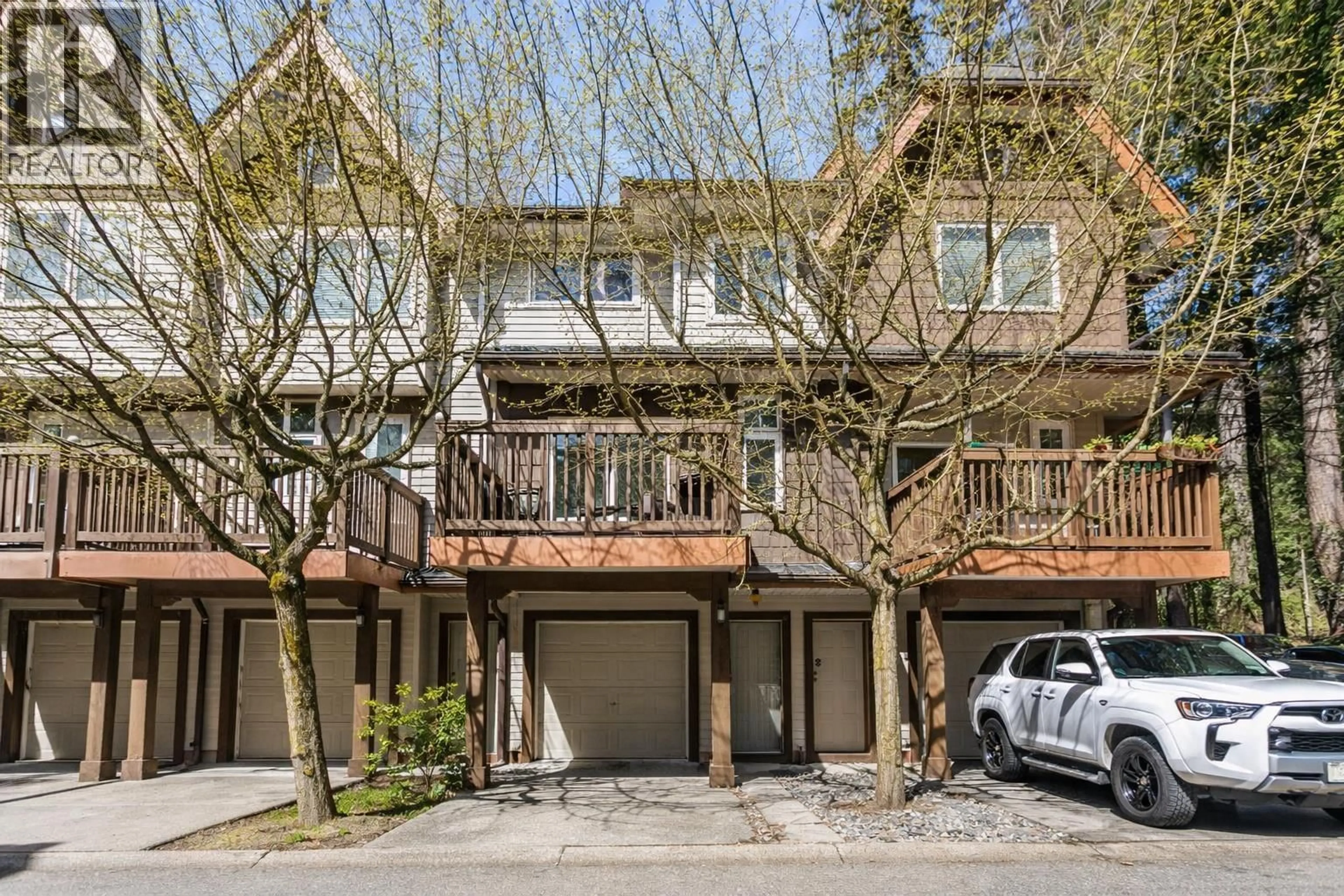 A pic from outside/outdoor area/front of a property/back of a property/a pic from drone, street for 103 - 2000 PANORAMA DRIVE, Port Moody British Columbia V3H5J5