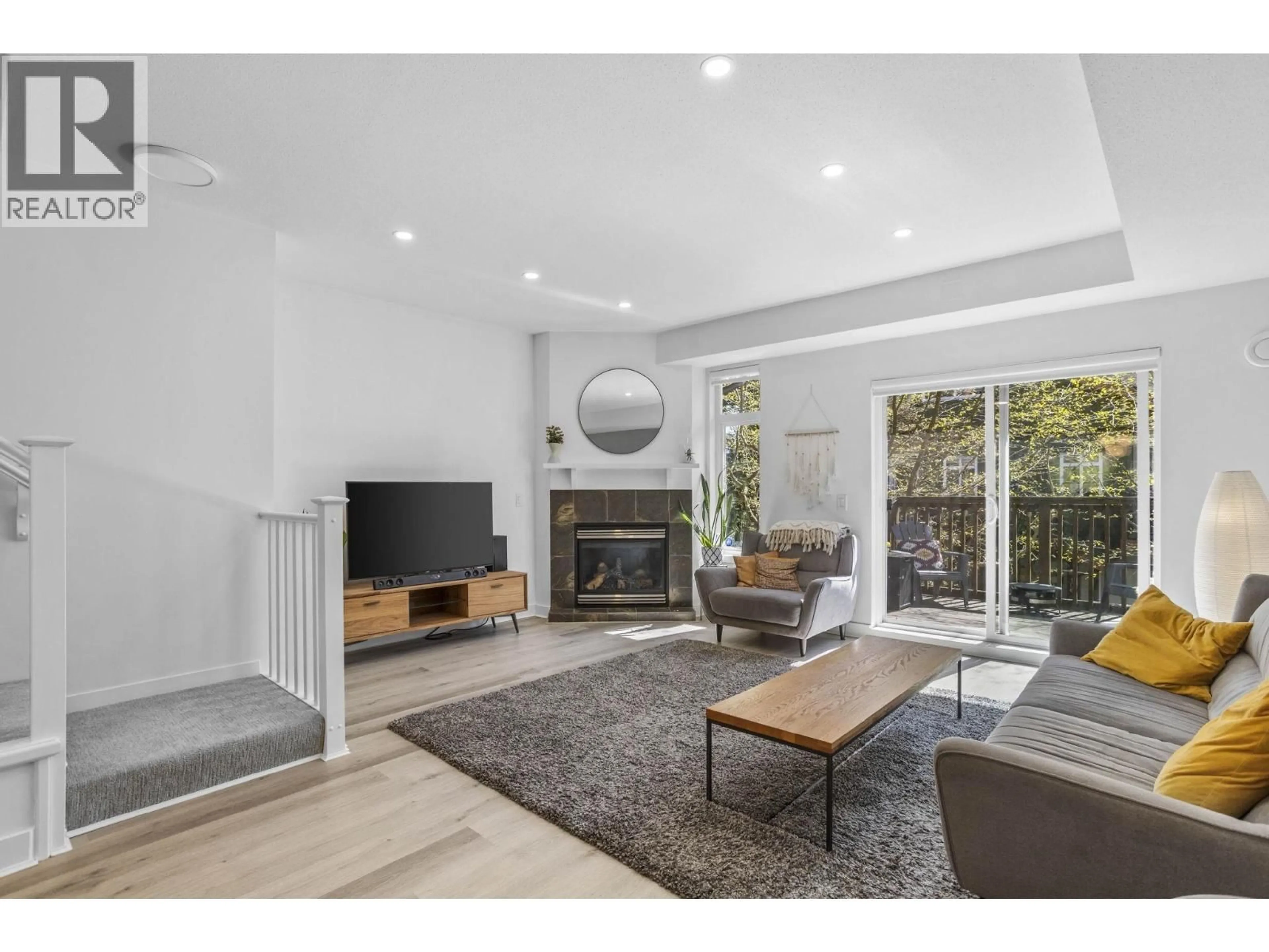 Living room with furniture, unknown for 103 - 2000 PANORAMA DRIVE, Port Moody British Columbia V3H5J5