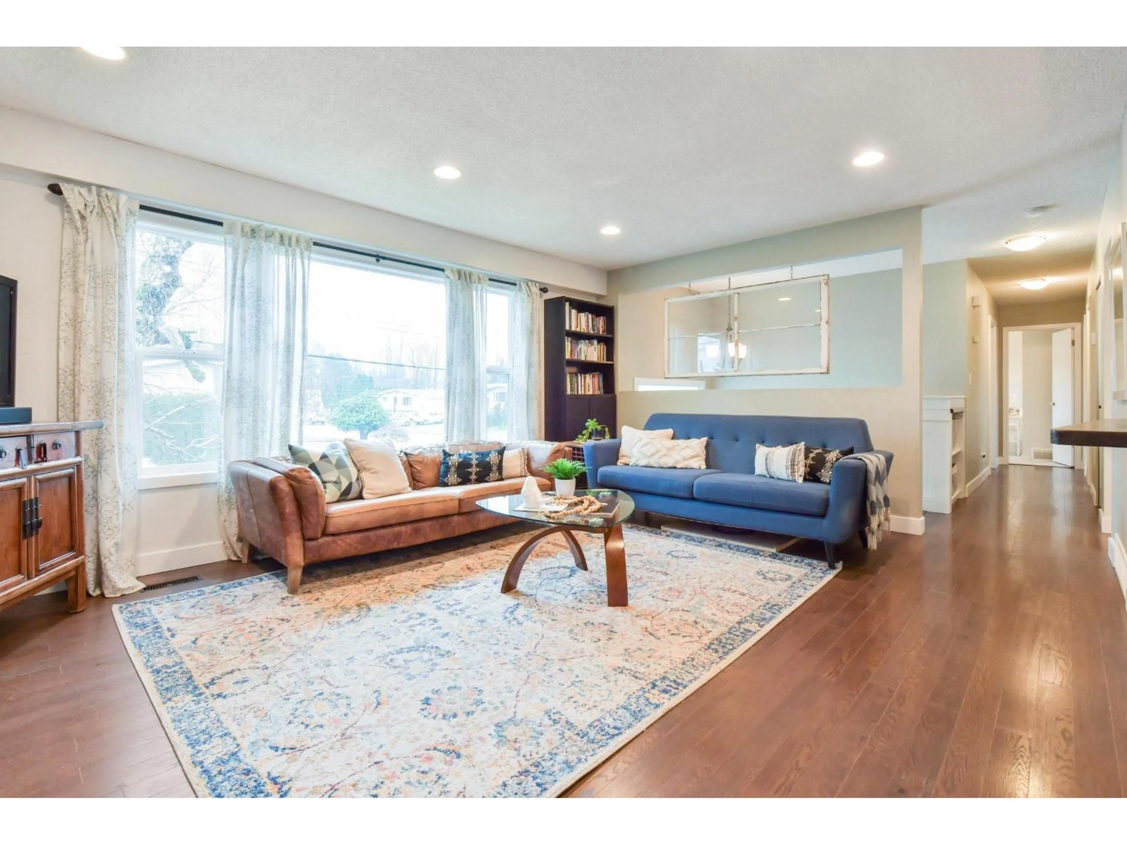 Living room with furniture, wood/laminate floor for 10008 DUBLIN DRIVE, Chilliwack British Columbia V2P6K7