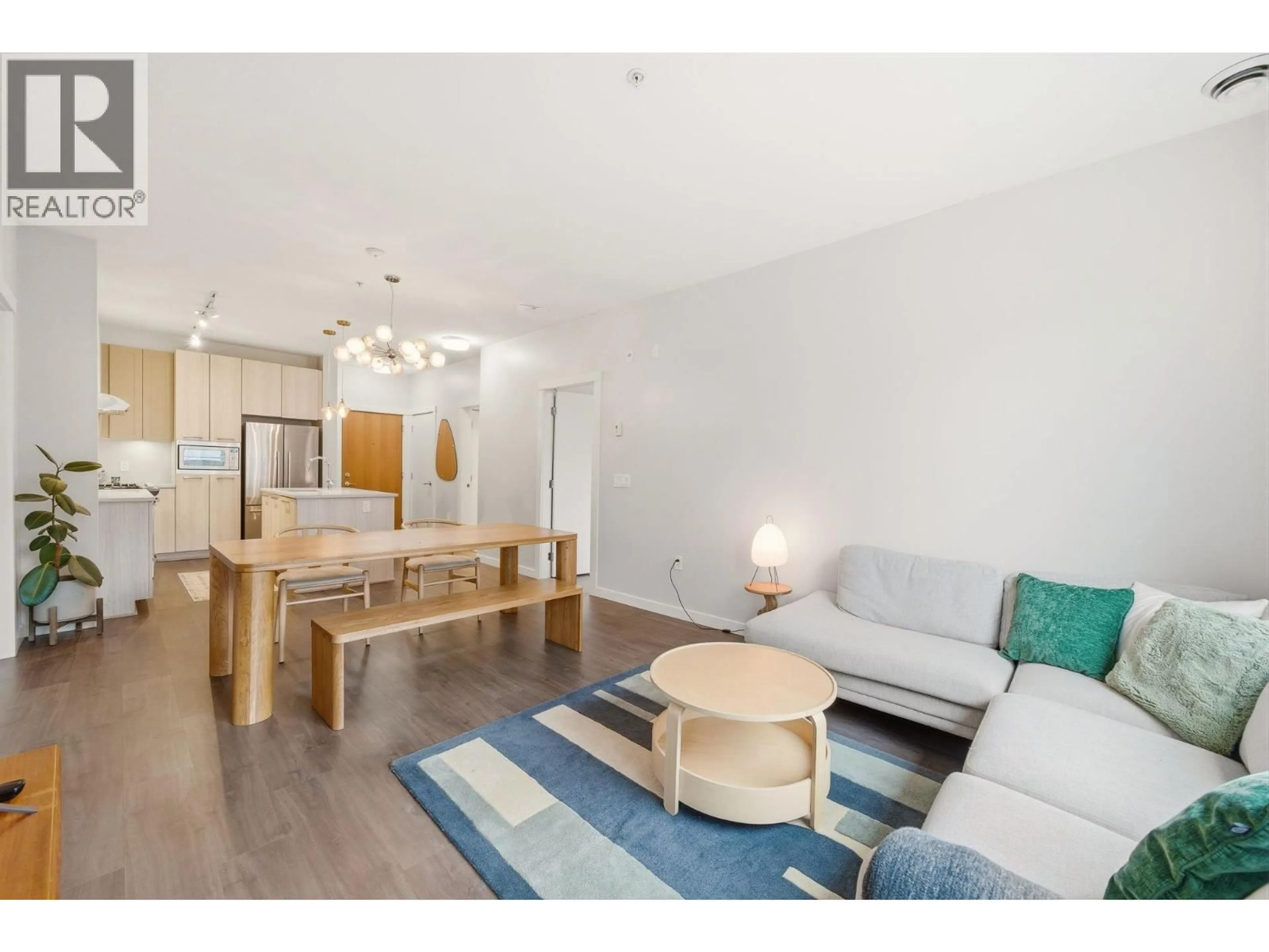 Living room with furniture, wood/laminate floor for 304 - 123 1ST STREET, North Vancouver British Columbia V7M0E5