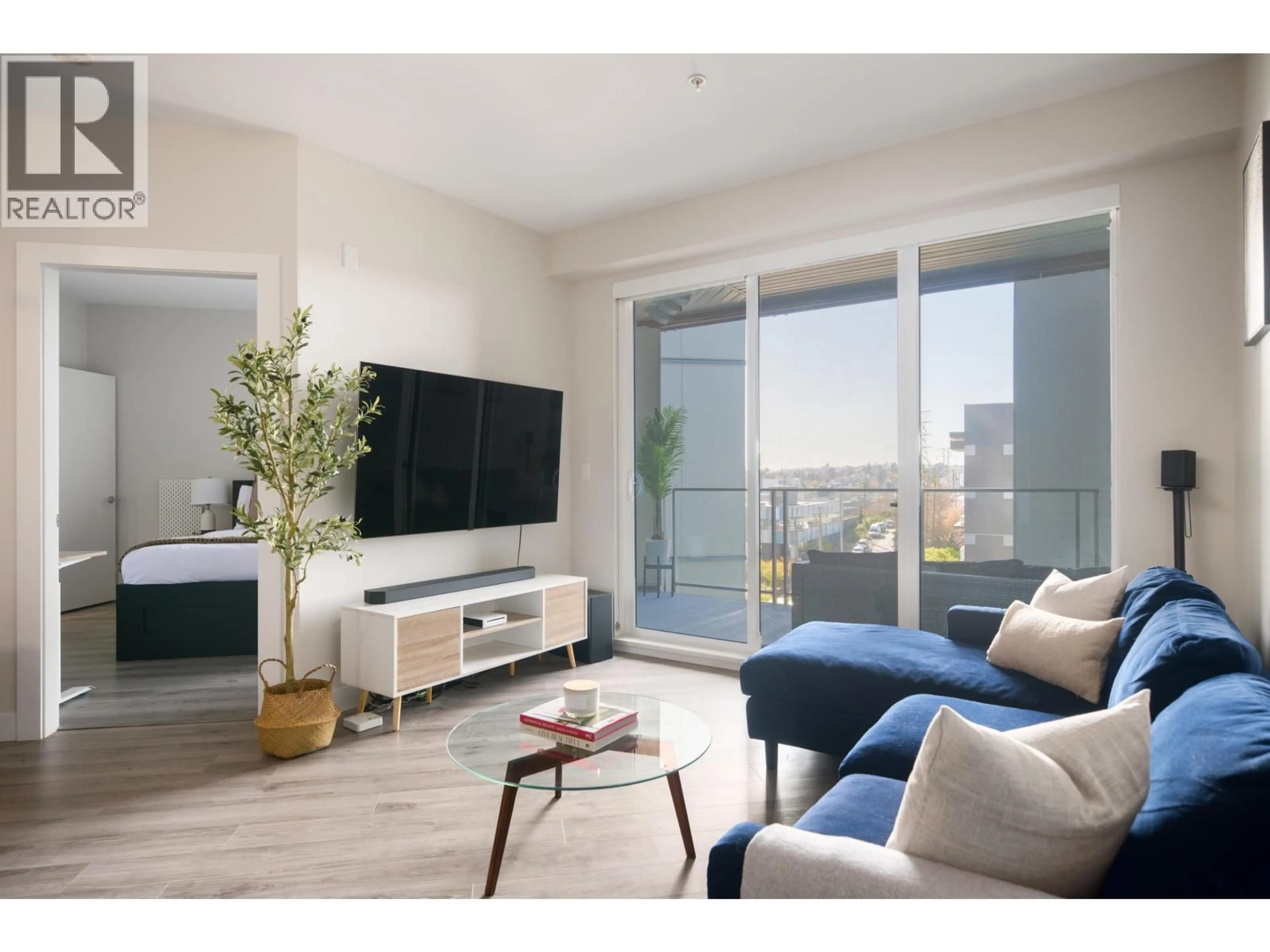 Living room with furniture, wood/laminate floor for 303 - 1768 GILMORE AVENUE, Burnaby British Columbia V5C0L4