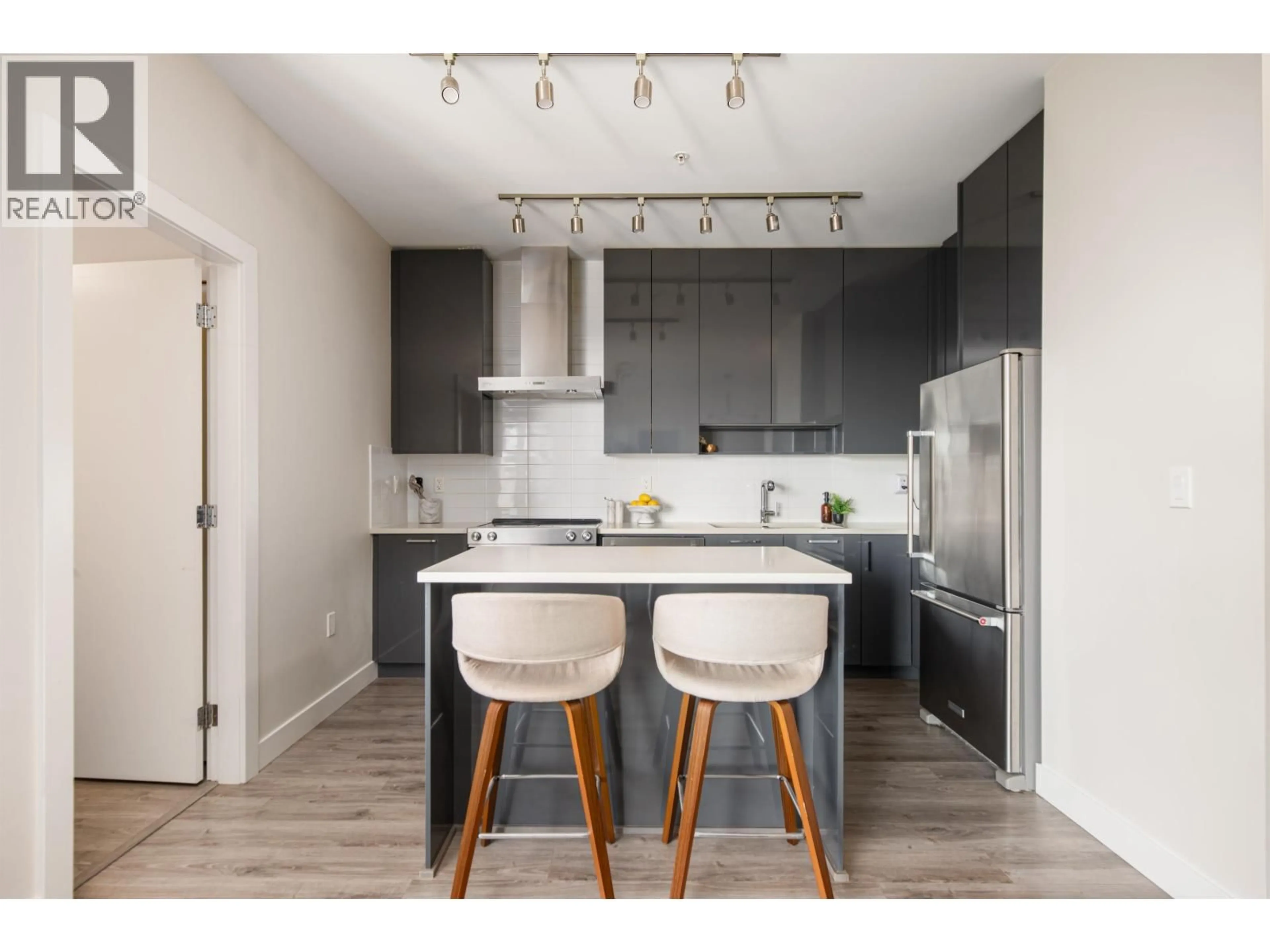 Open concept kitchen, wood/laminate floor for 303 - 1768 GILMORE AVENUE, Burnaby British Columbia V5C0L4
