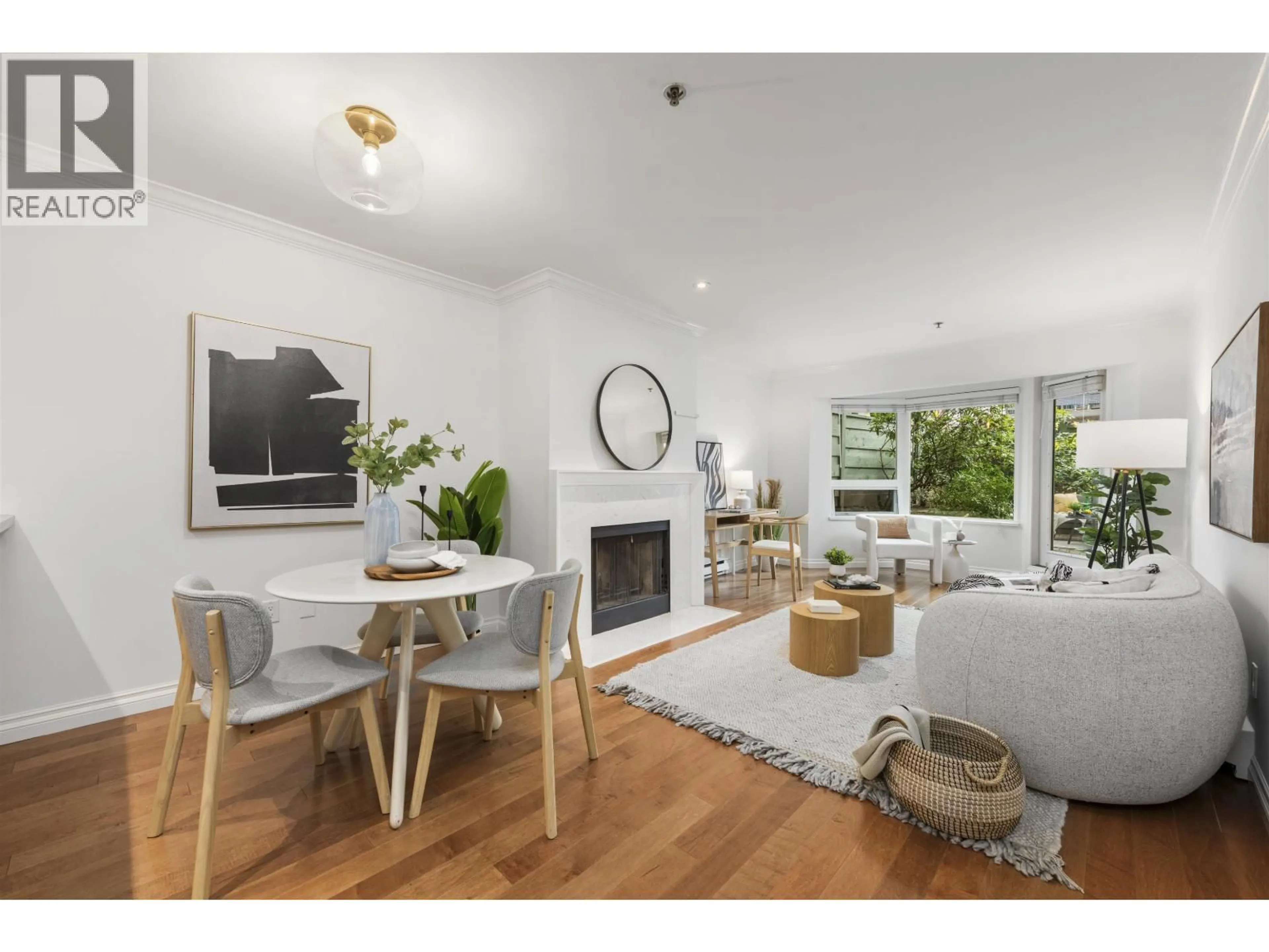 Living room with furniture, wood/laminate floor for 103 - 1925 2ND AVENUE, Vancouver British Columbia V6J1J2