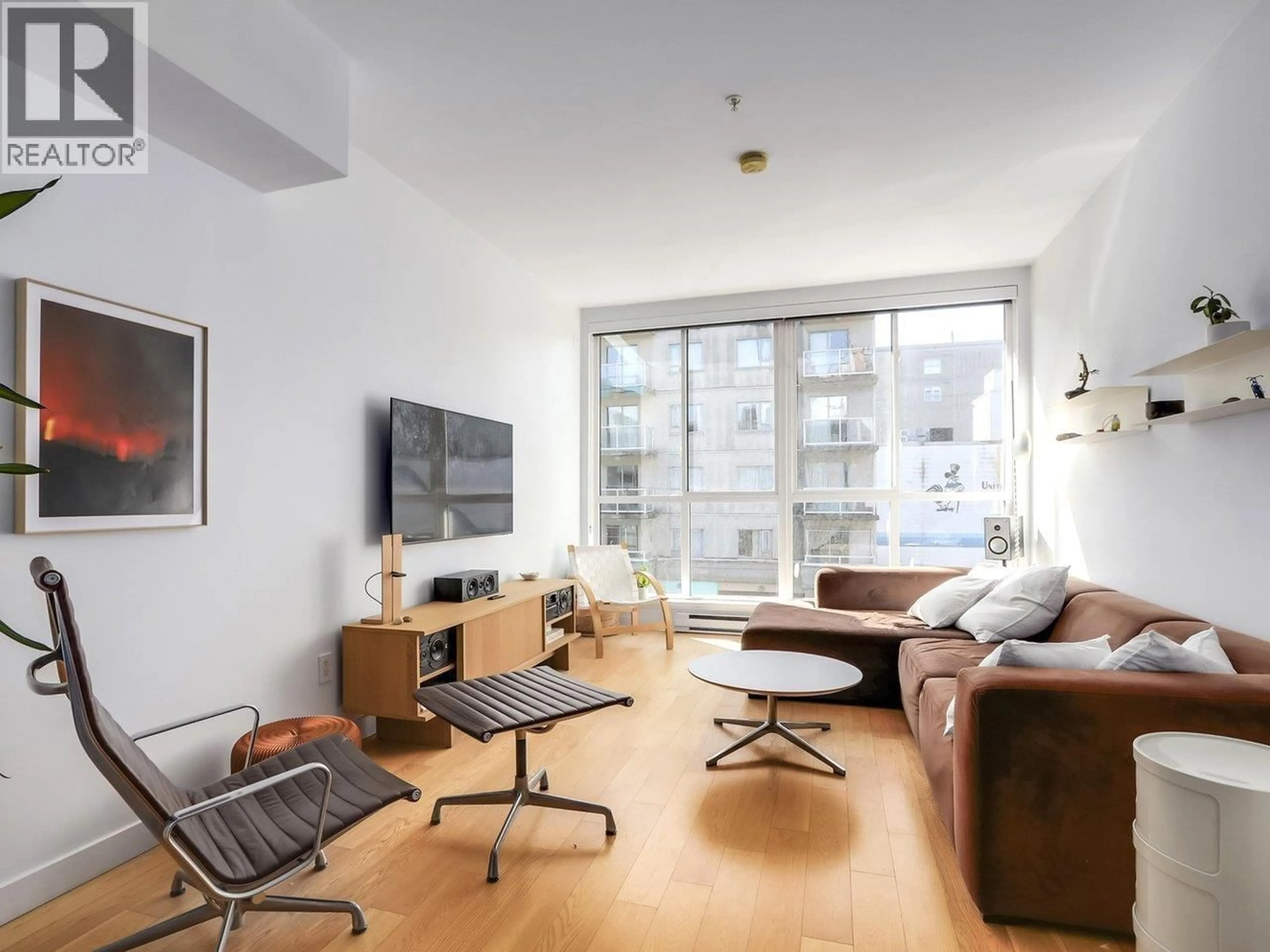 Living room with furniture, wood/laminate floor for 312 - 557 CORDOVA STREET, Vancouver British Columbia V6A1L8