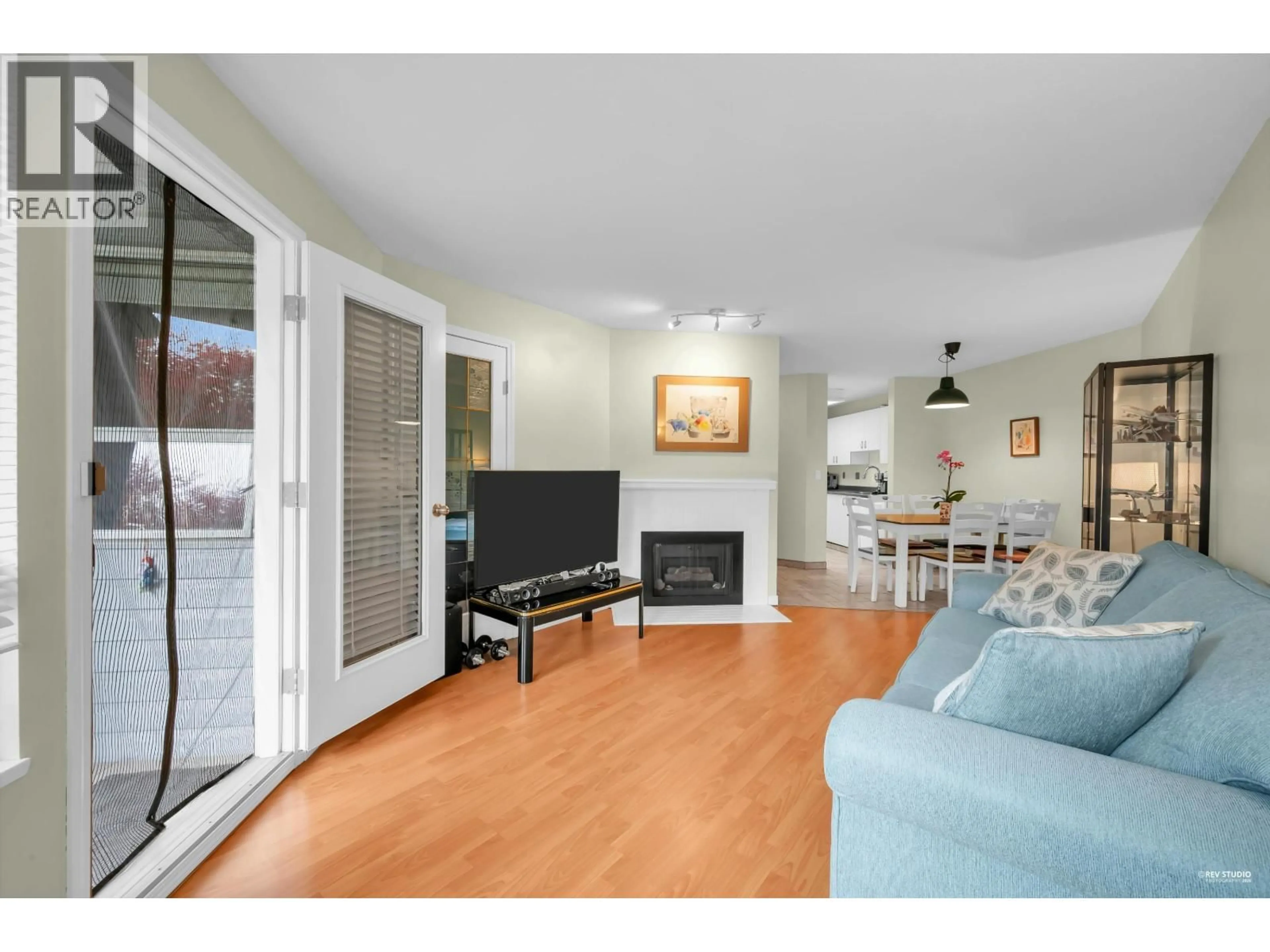 Living room with furniture, wood/laminate floor for 101 - 7840 MOFFATT ROAD, Richmond British Columbia V6Y1X8