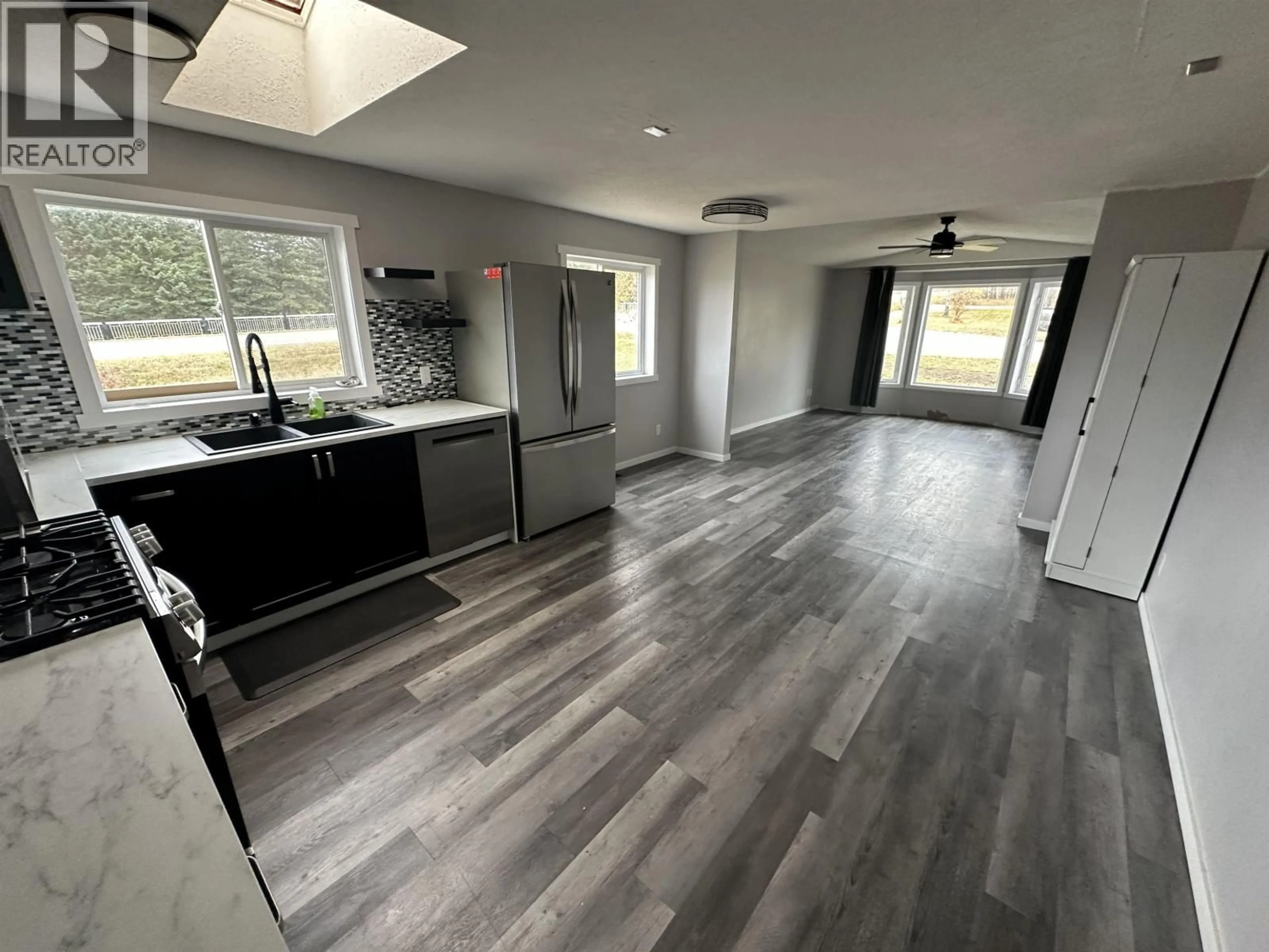 Open concept kitchen, wood/laminate floor for 89 - 12842 OLD HOPE ROAD, Charlie Lake British Columbia V1J4M7