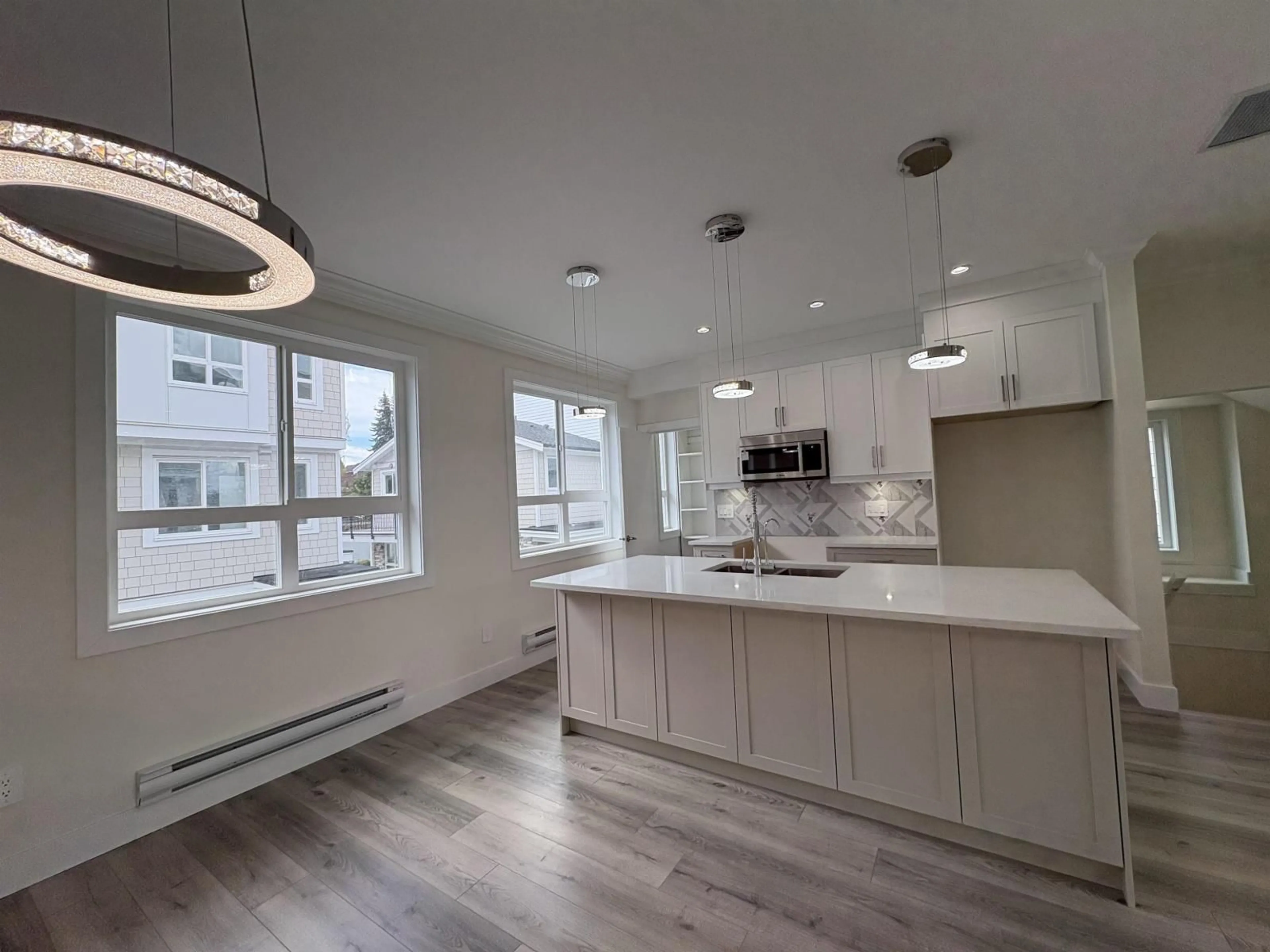 Open concept kitchen, wood/laminate floor for 7 - 8181 135A STREET, Surrey British Columbia V3W3N8