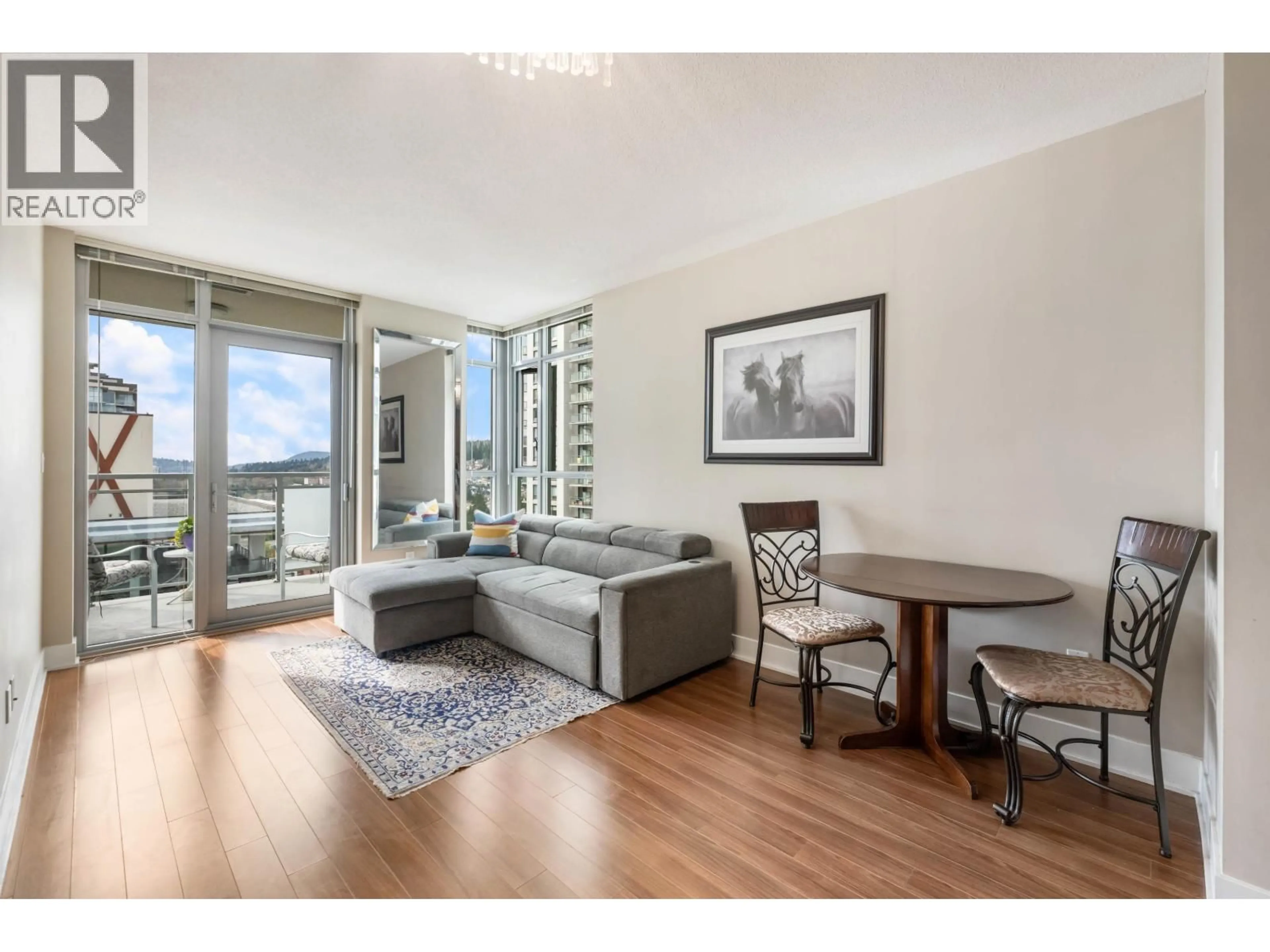 Living room with furniture, wood/laminate floor for 2301 - 3008 GLEN DRIVE, Coquitlam British Columbia V3B0J5