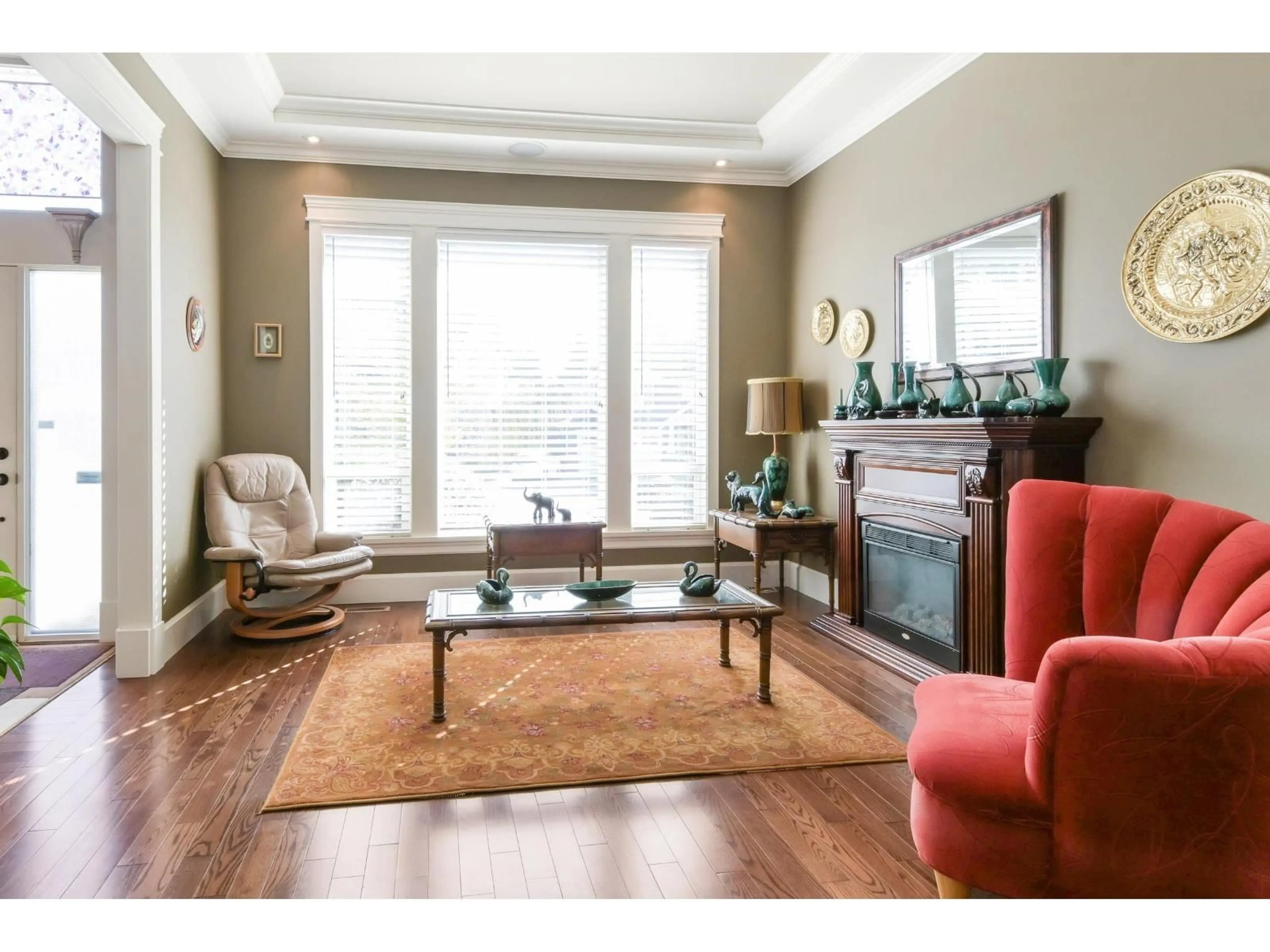 Living room with furniture, wood/laminate floor for 5879 165 STREET, Surrey British Columbia V3S4G2