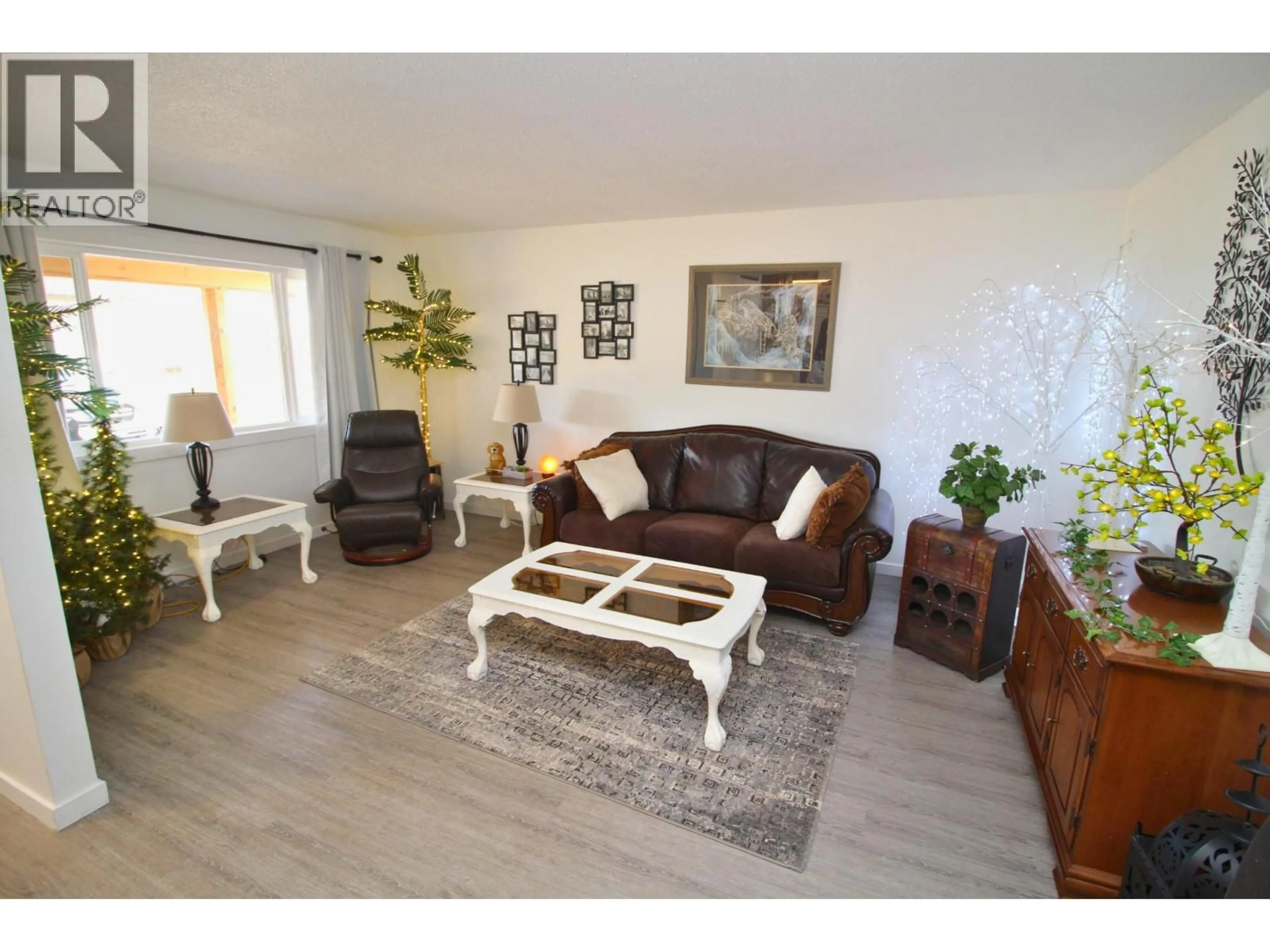 Living room with furniture, wood/laminate floor for 2180 CATALINE COURT, Houston British Columbia V0J1Z2