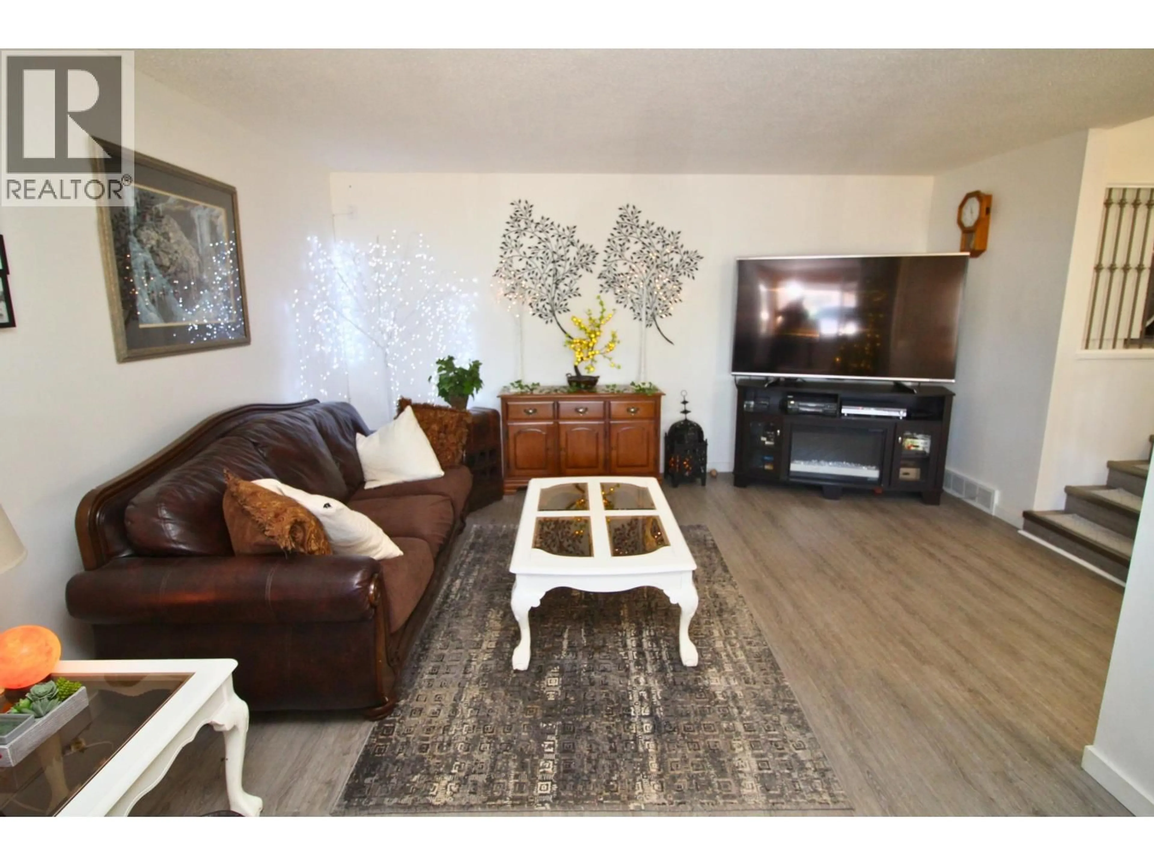 Living room with furniture, wood/laminate floor for 2180 CATALINE COURT, Houston British Columbia V0J1Z2