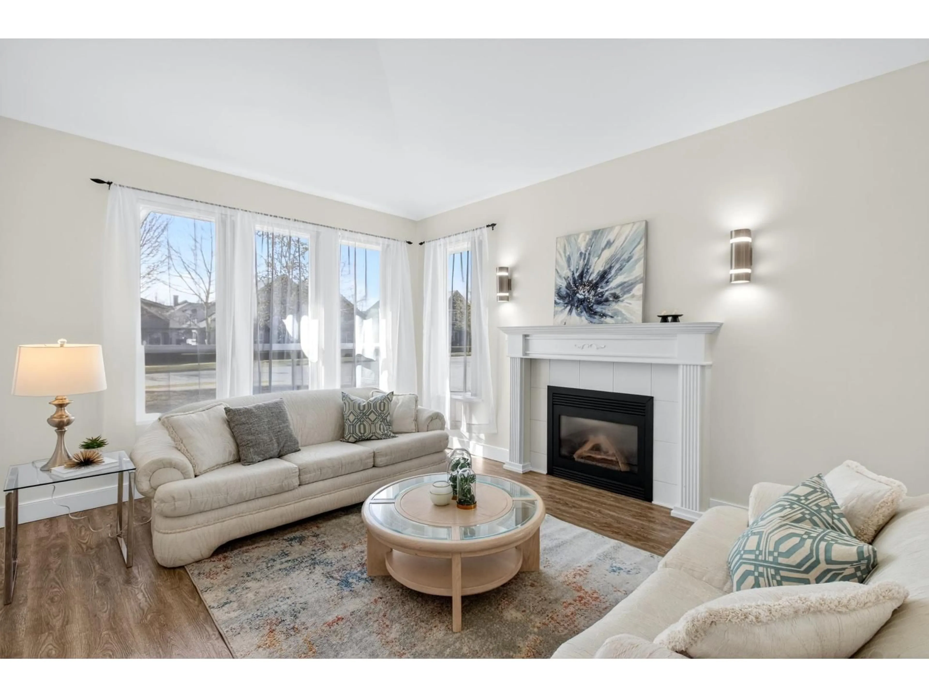 Living room with furniture, wood/laminate floor for 18755 65 AVENUE, Surrey British Columbia V3S8V2