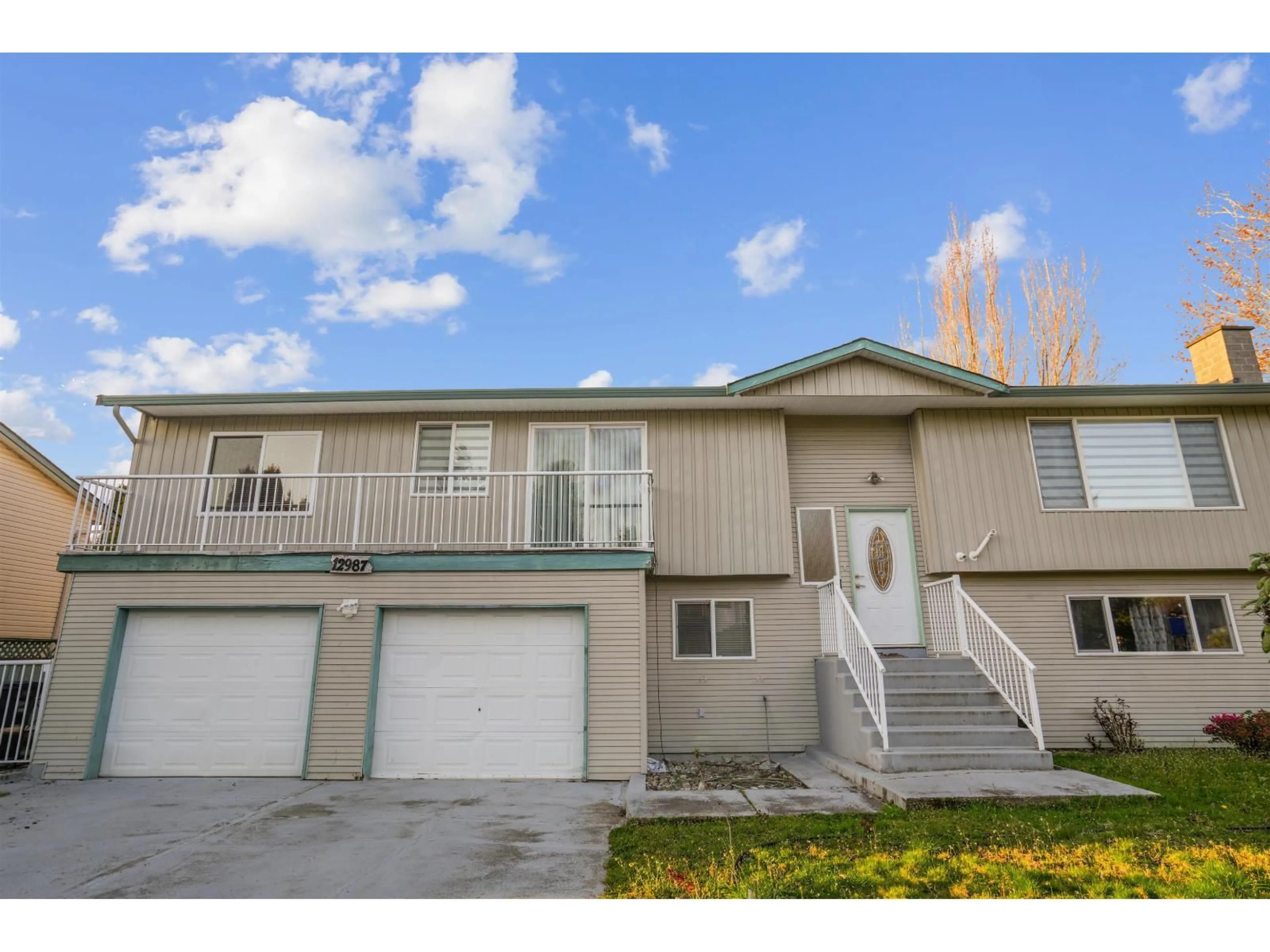 Home with vinyl exterior material, street for 12987 62 AVENUE AVENUE, Surrey British Columbia V3X2E9