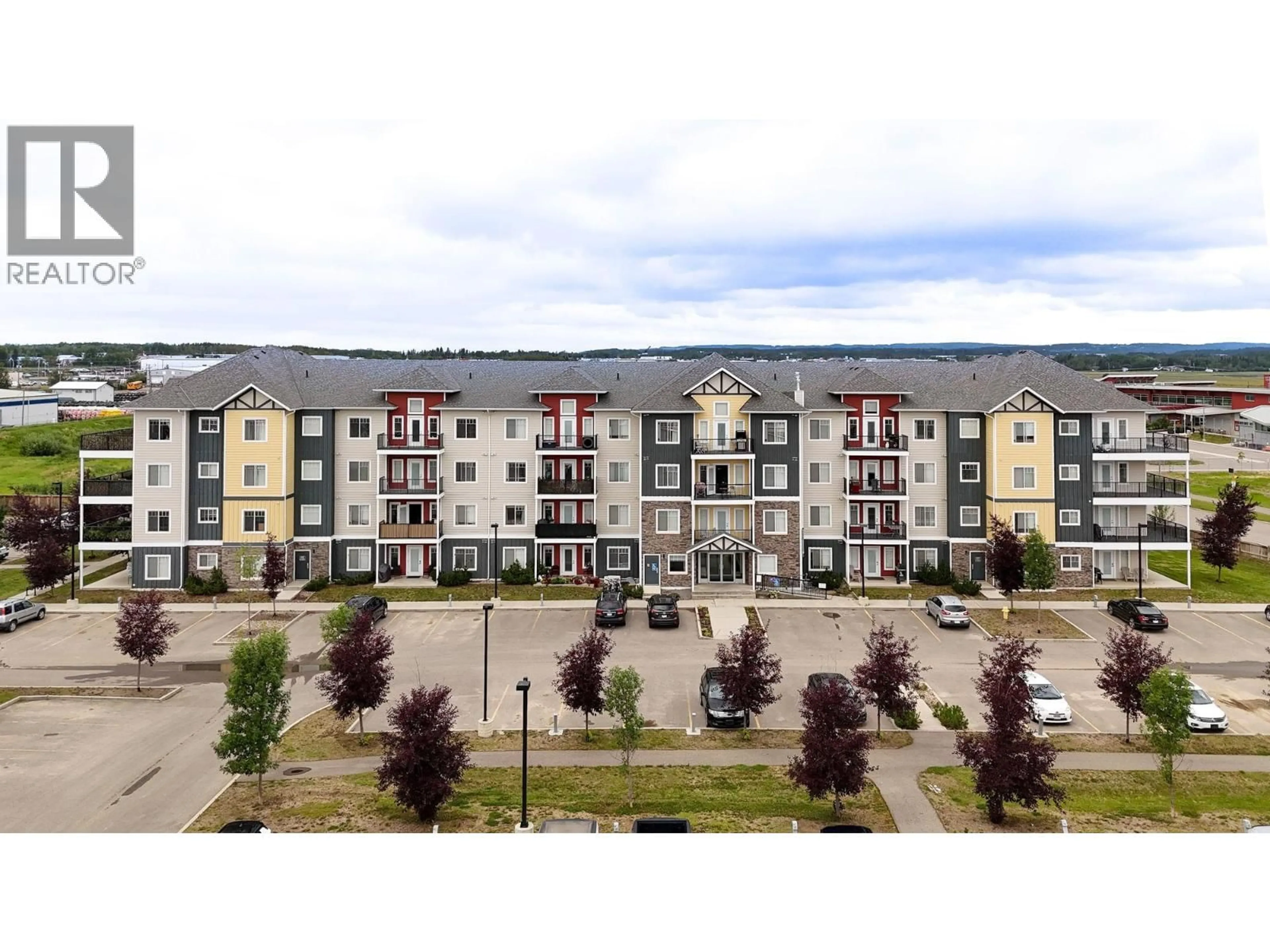 A pic from outside/outdoor area/front of a property/back of a property/a pic from drone, mountain view for 213 - 11205 105 AVENUE, Fort St. John British Columbia V1J0L3