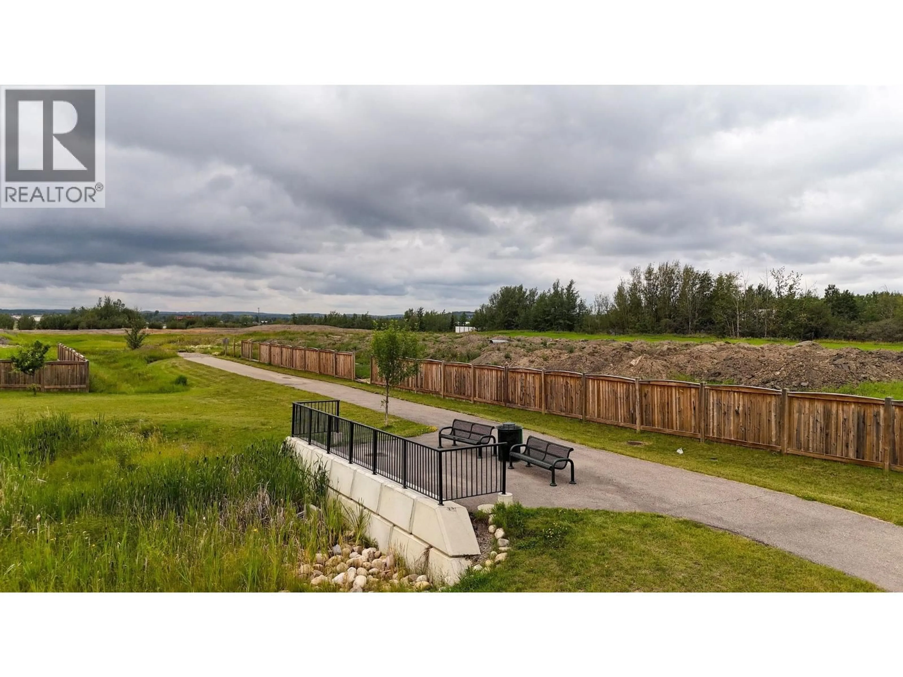 A pic from outside/outdoor area/front of a property/back of a property/a pic from drone, unknown for 213 - 11205 105 AVENUE, Fort St. John British Columbia V1J0L3