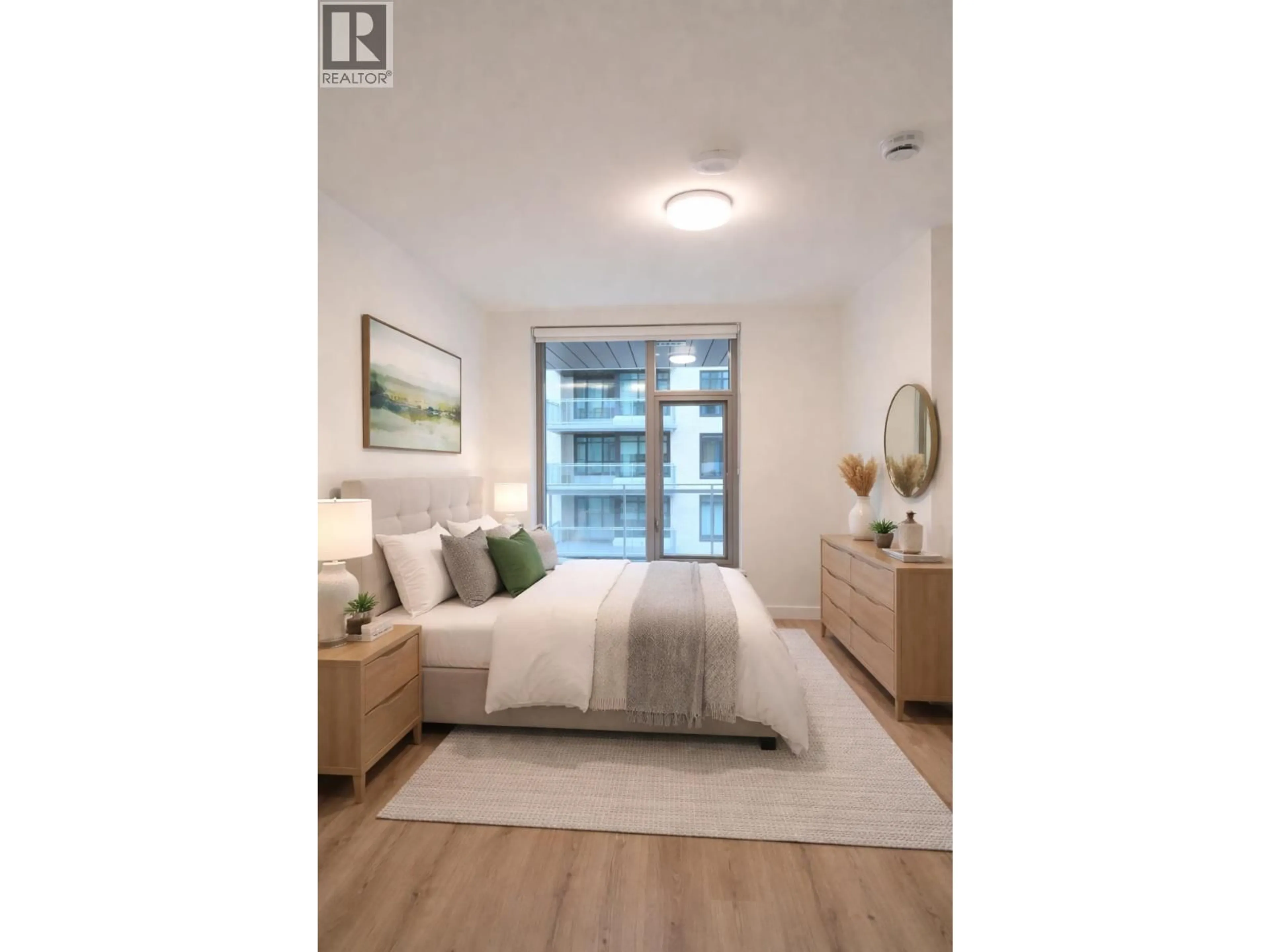 Bedroom with bed, wood/laminate floor for 425 - 755 HARBOURSIDE DRIVE, North Vancouver British Columbia V7P0G1
