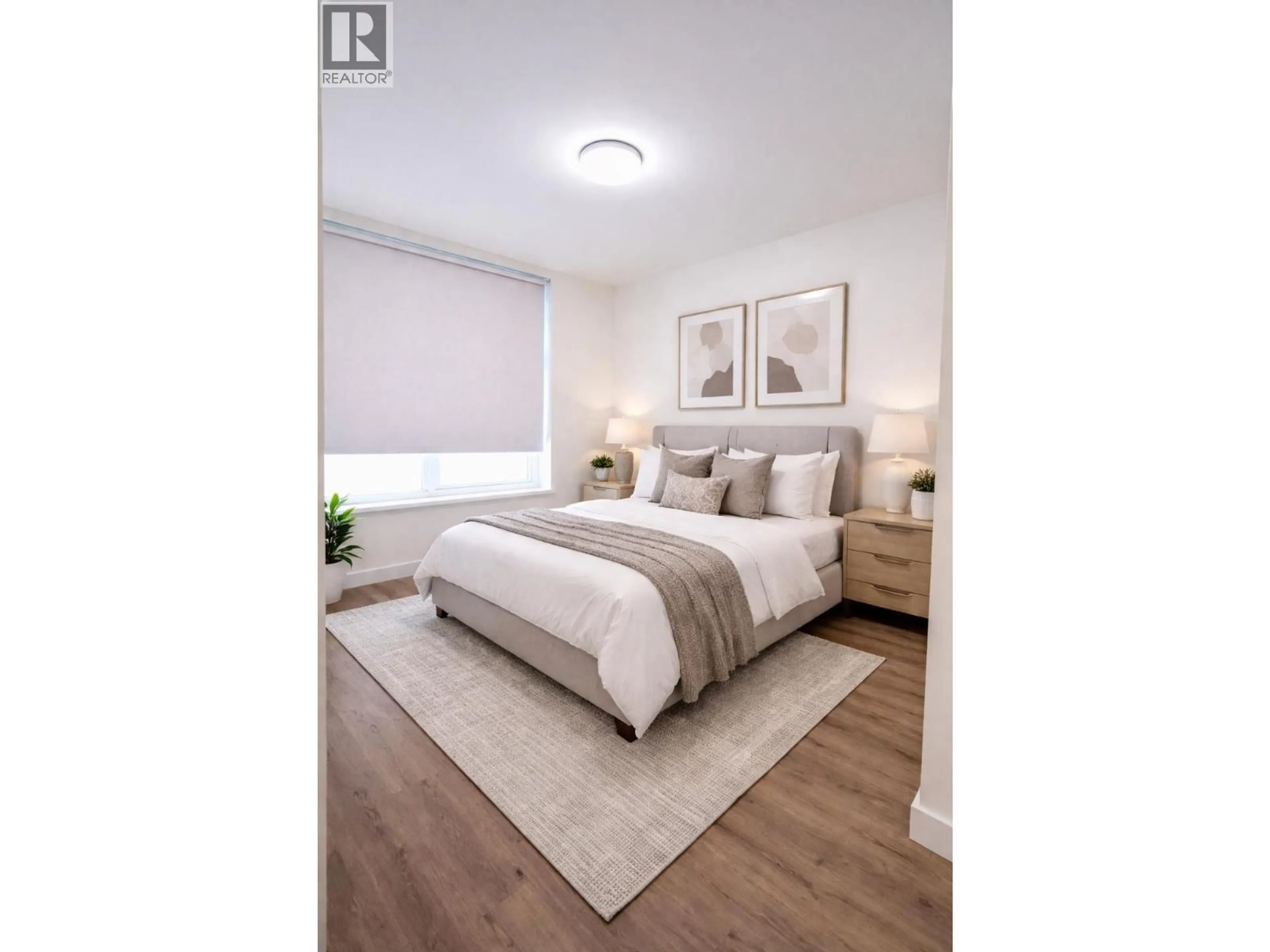 Bedroom with bed, wood/laminate floor for 425 - 755 HARBOURSIDE DRIVE, North Vancouver British Columbia V7P0G1