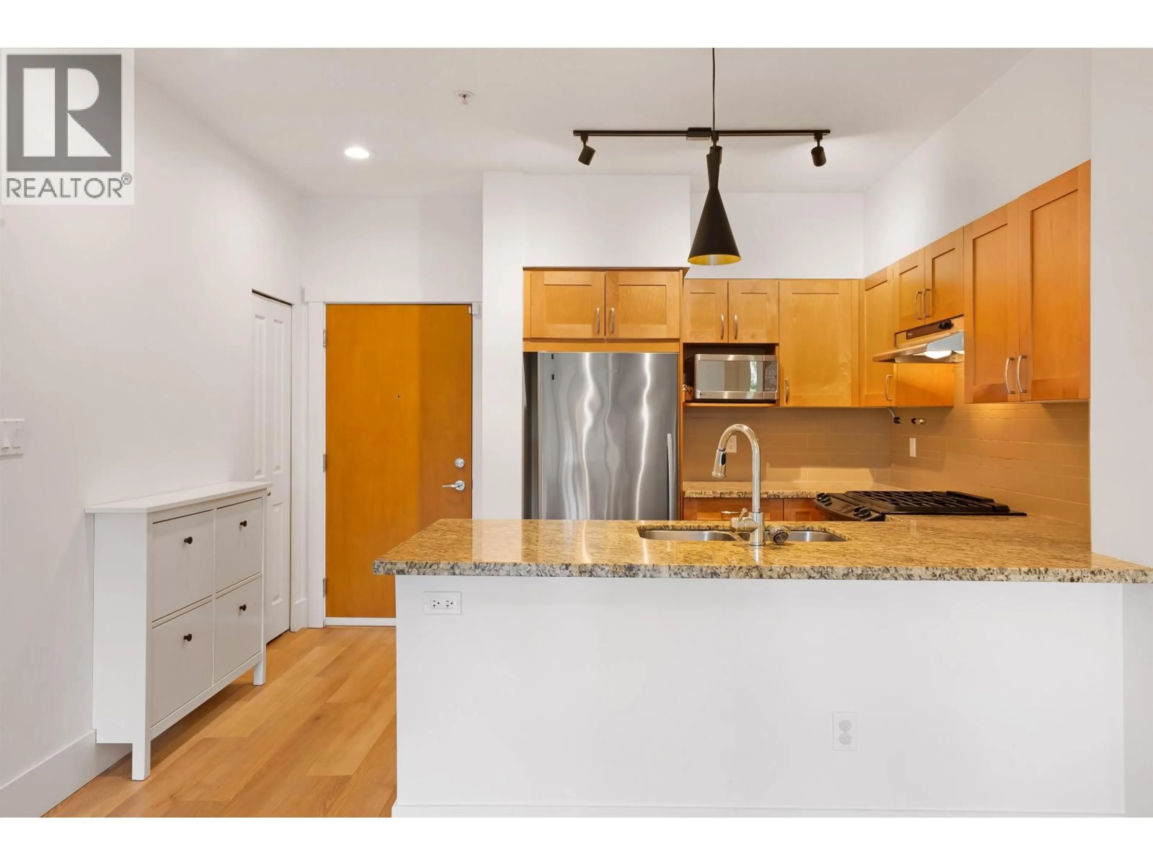 Open concept kitchen, unknown for 103 - 1111 27TH STREET, North Vancouver British Columbia V7J1S3