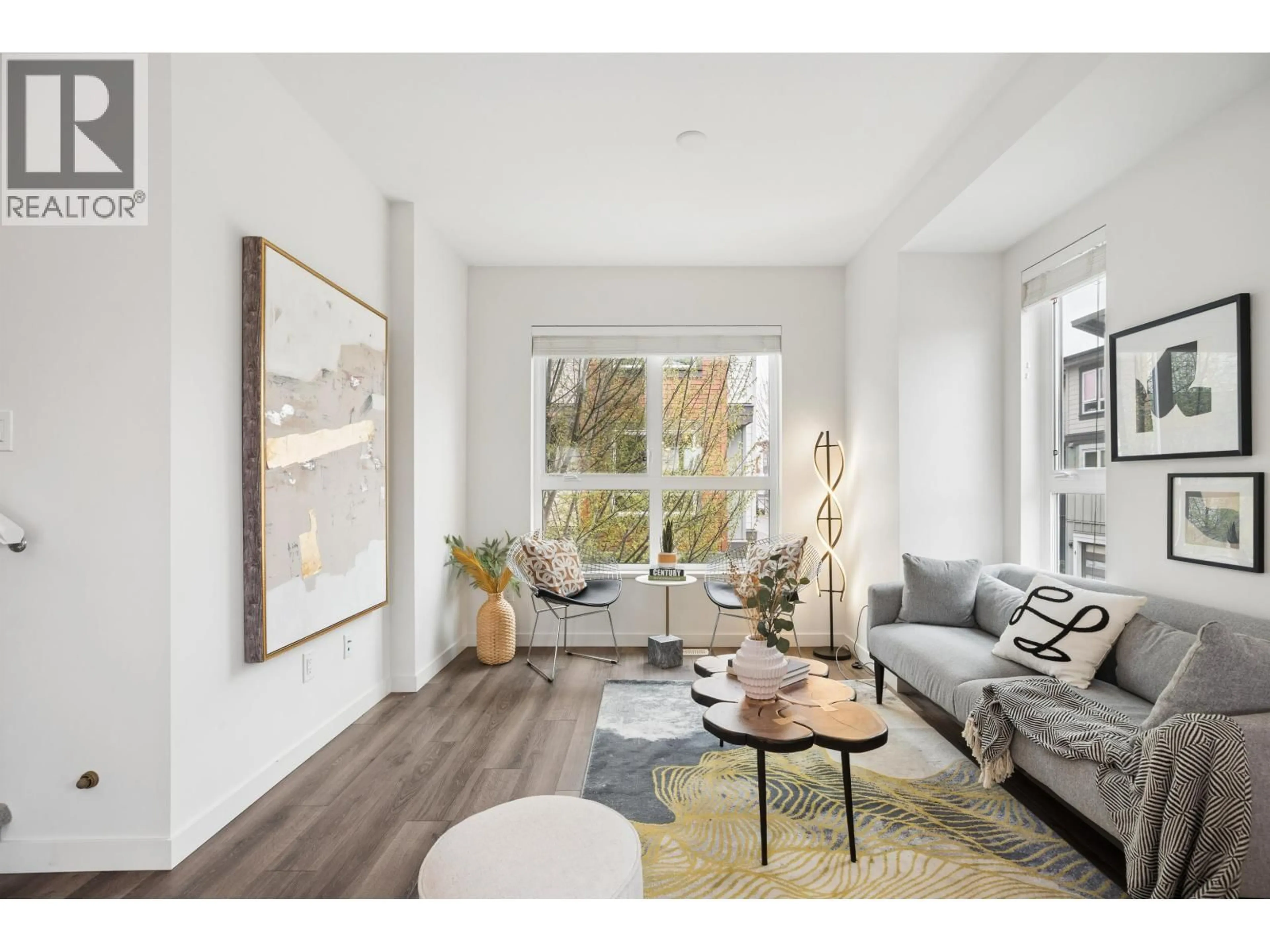 Living room with furniture, wood/laminate floor for 58 - 10311 RIVER DRIVE, Richmond British Columbia V6X0T2