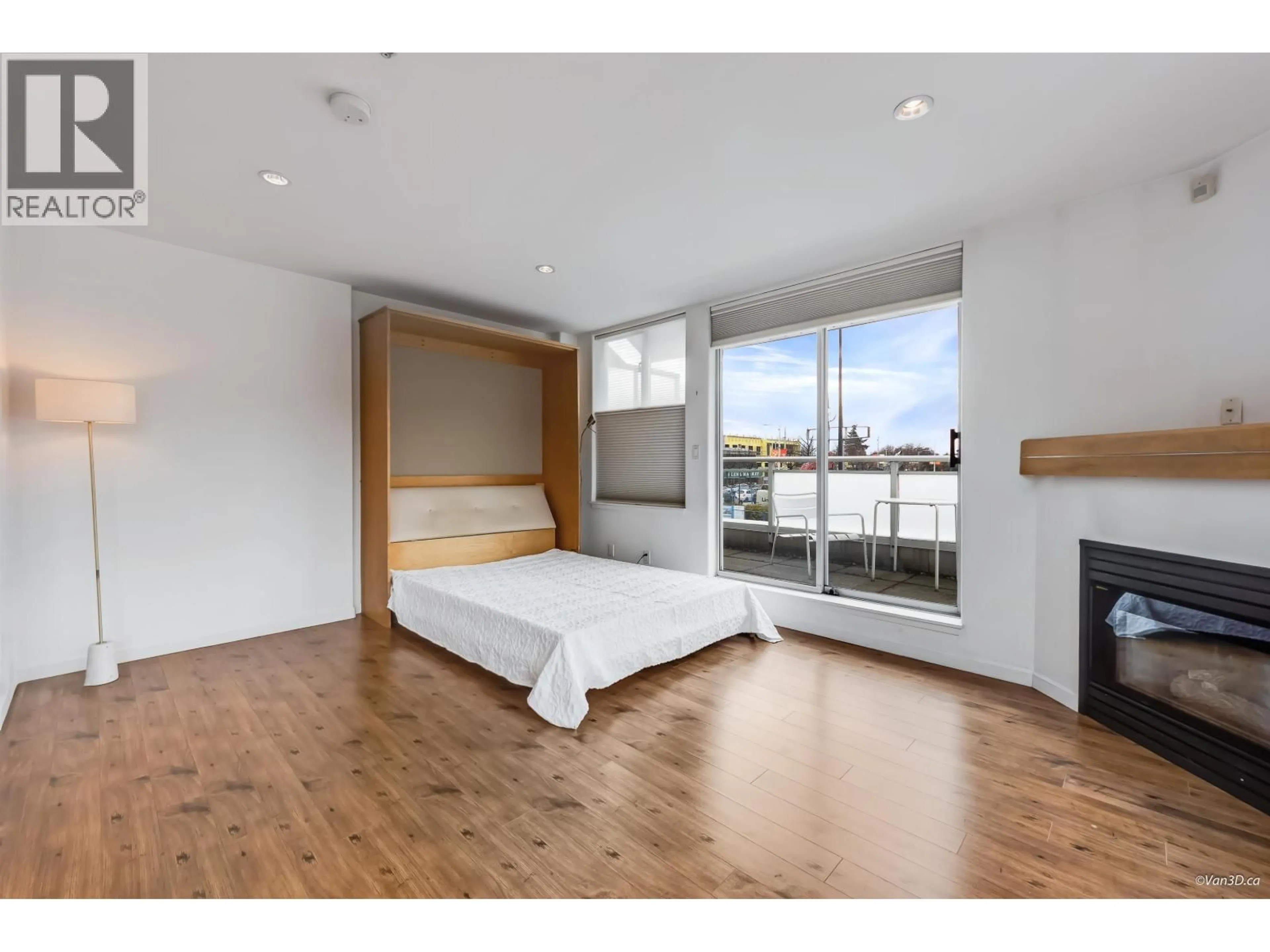 Bedroom with bed, wood/laminate floor for 206 - 1978 VINE STREET, Vancouver British Columbia V6K4S1