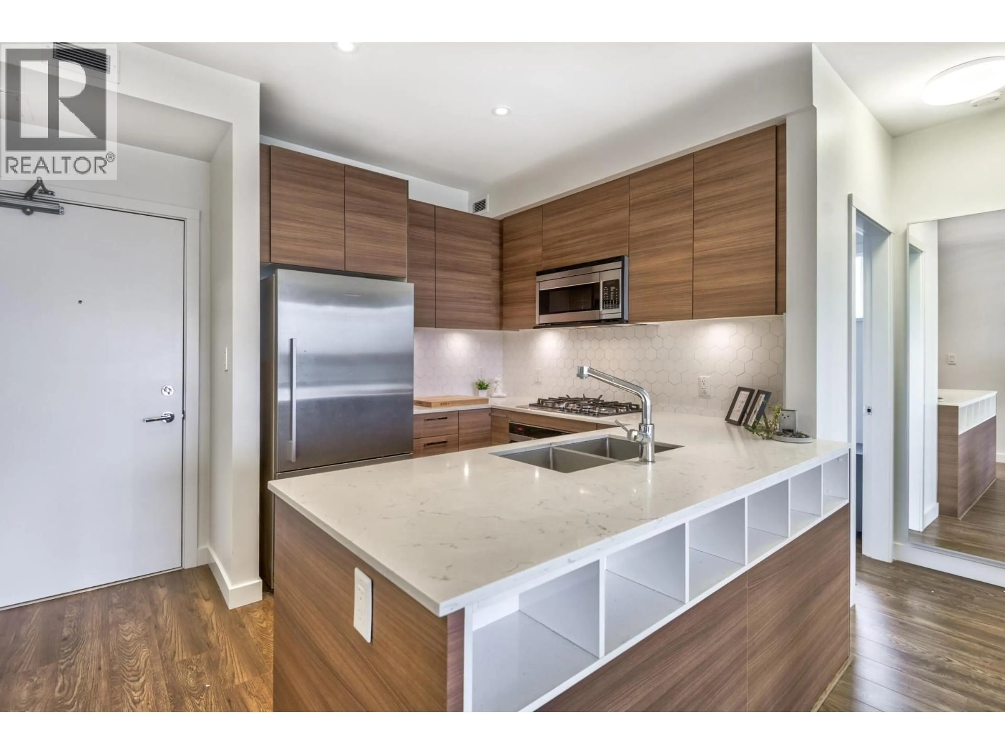 Open concept kitchen, wood/laminate floor for 402 - 1061 MARINE DRIVE, North Vancouver British Columbia V7P1S6