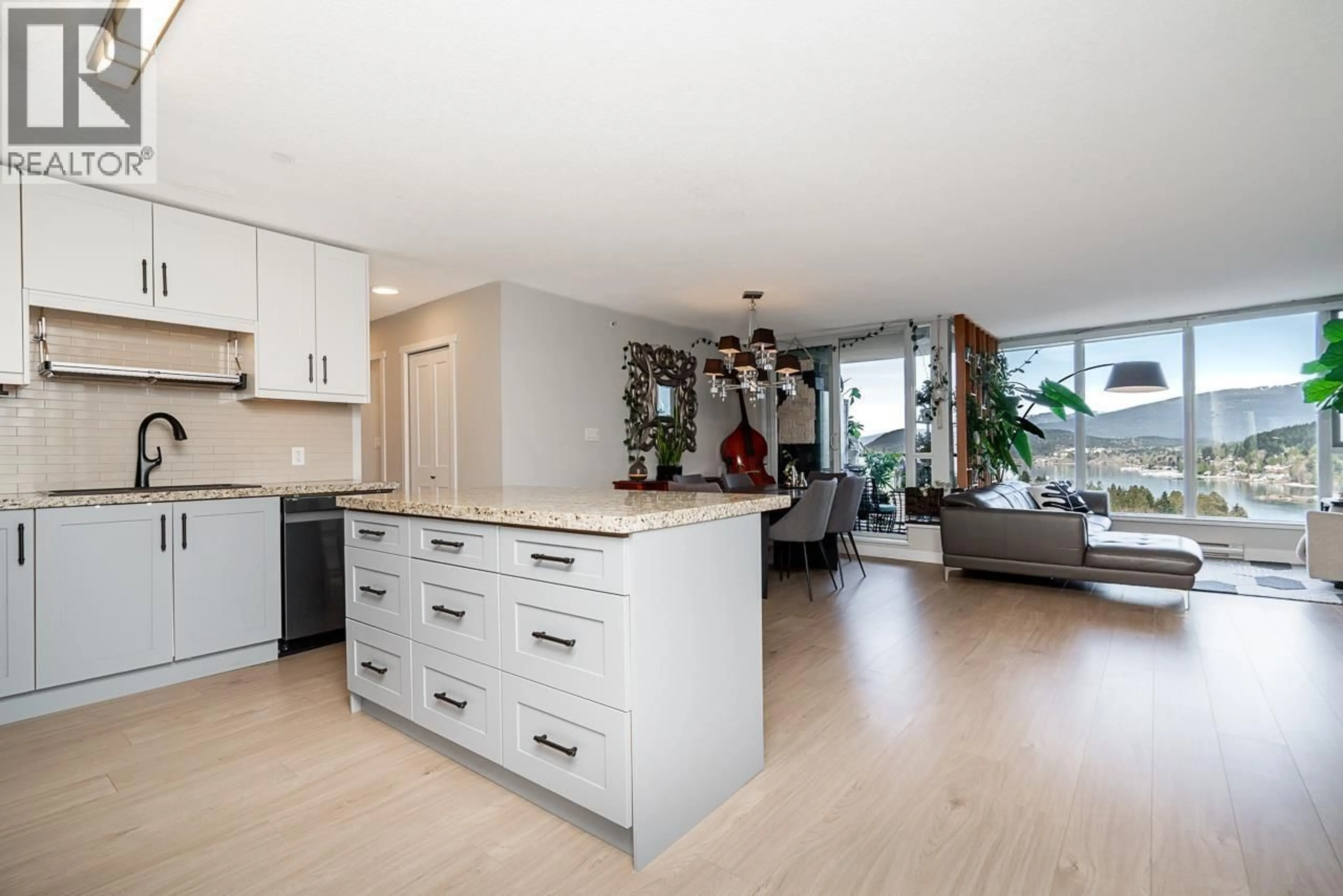 Open concept kitchen, wood/laminate floor for 2303 - 660 NOOTKA WAY, Port Moody British Columbia V3H0B7