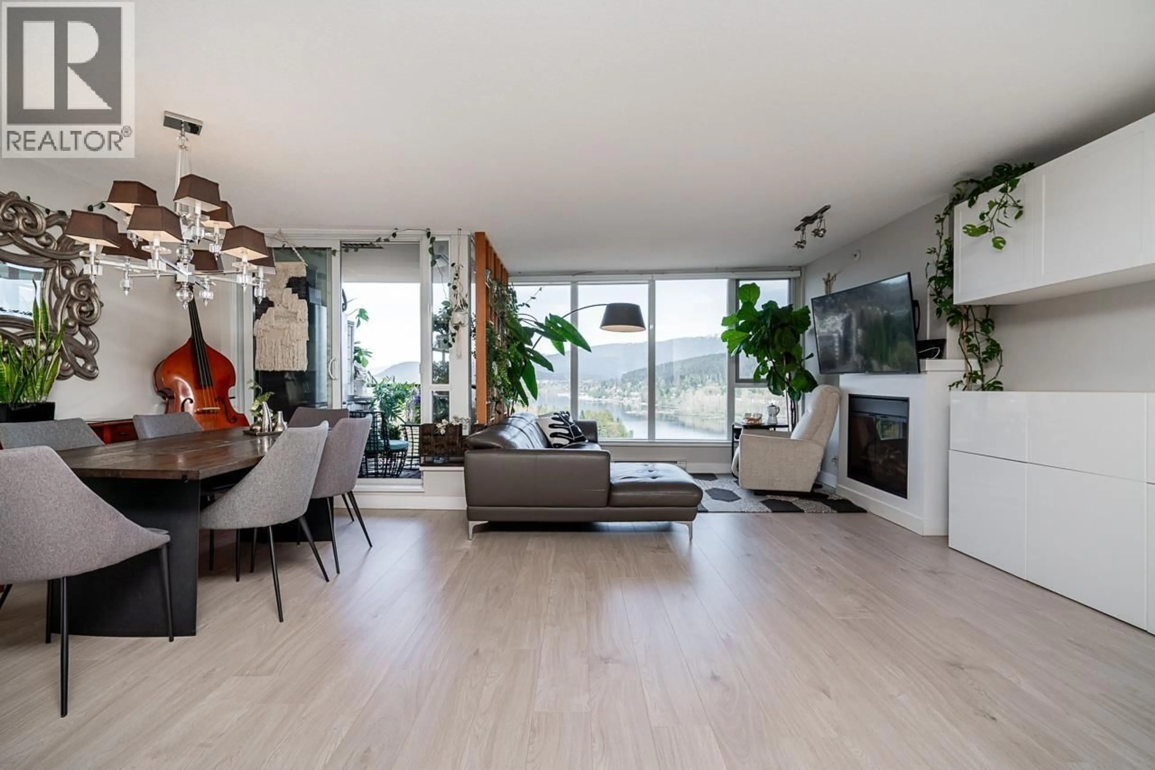 Living room with furniture, wood/laminate floor for 2303 - 660 NOOTKA WAY, Port Moody British Columbia V3H0B7