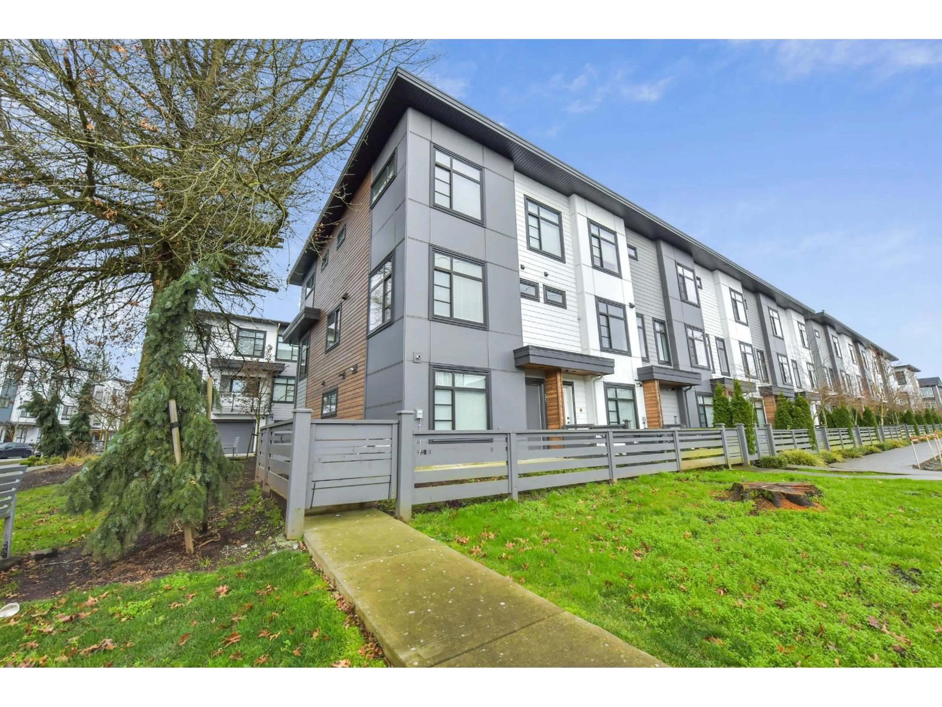 A pic from outside/outdoor area/front of a property/back of a property/a pic from drone, street for 31 - 7127 193A STREET, Surrey British Columbia V4N6V9