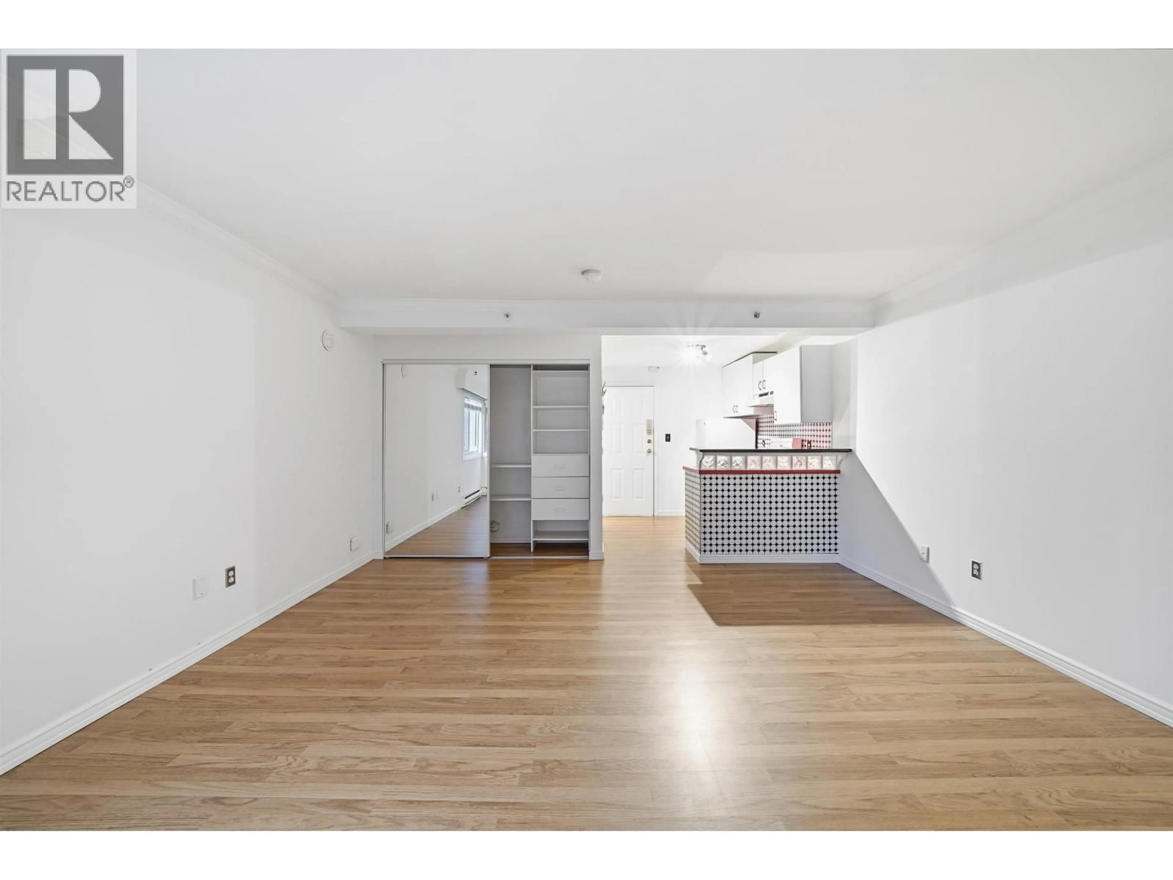 Open concept kitchen, wood/laminate floor for 107 - 1940 BARCLAY STREET, Vancouver British Columbia V6G1L3