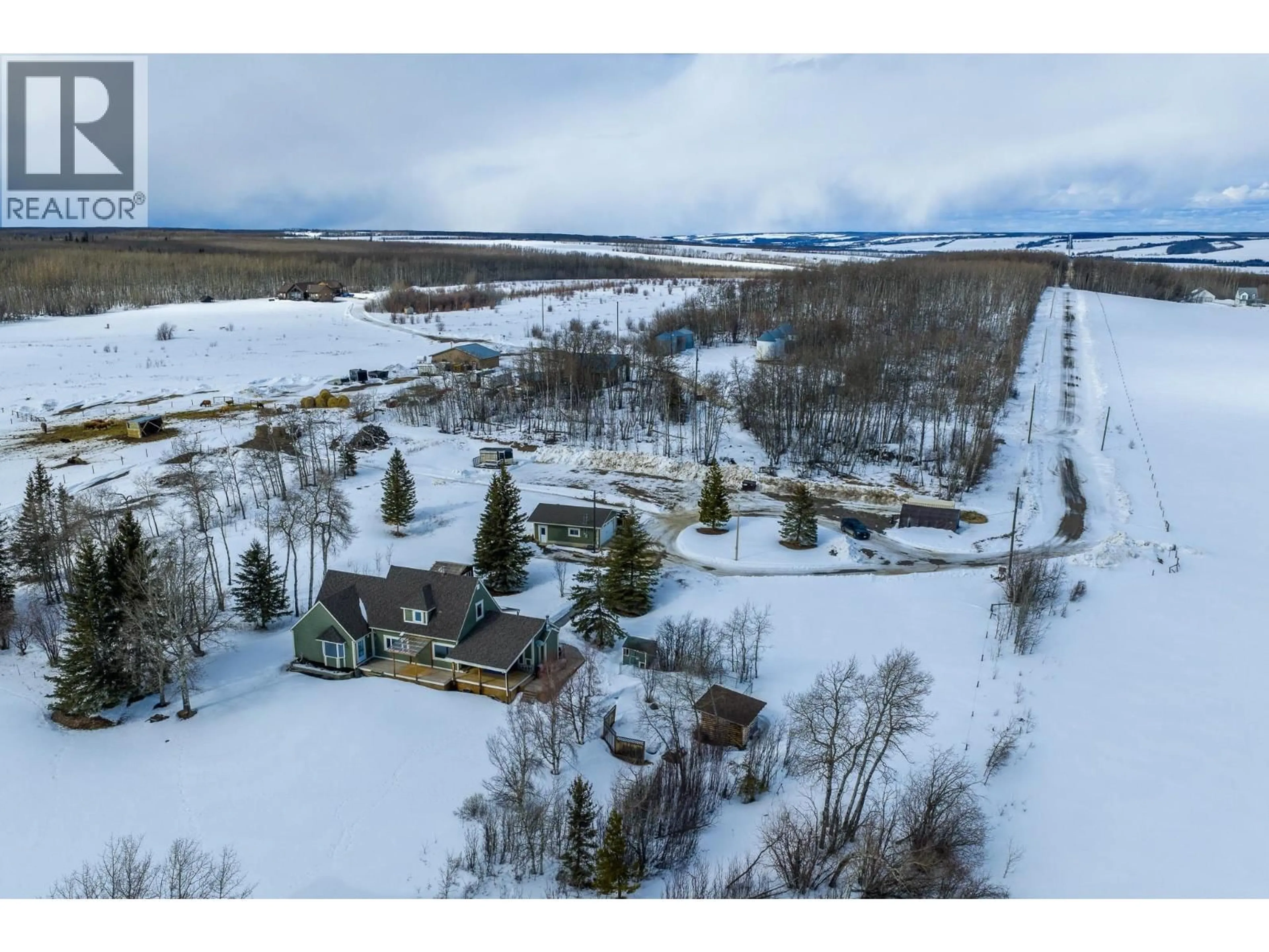 A pic from outside/outdoor area/front of a property/back of a property/a pic from drone, mountain view for 14147 SMITH ROAD, Fort St. John British Columbia V1J4M6