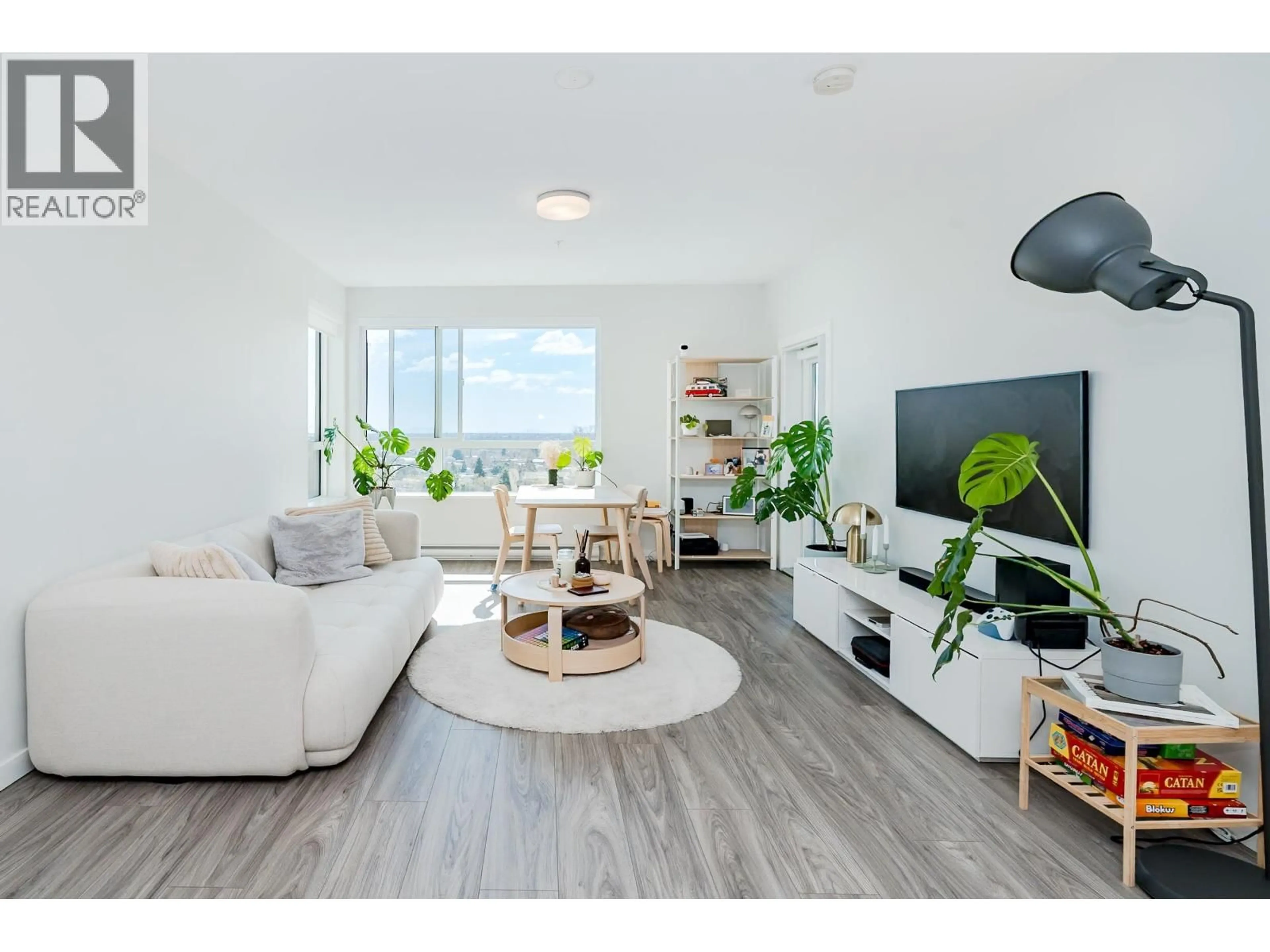 Living room with furniture, wood/laminate floor for 416 - 6438 BYRNEPARK DRIVE, Burnaby British Columbia V3N0J1