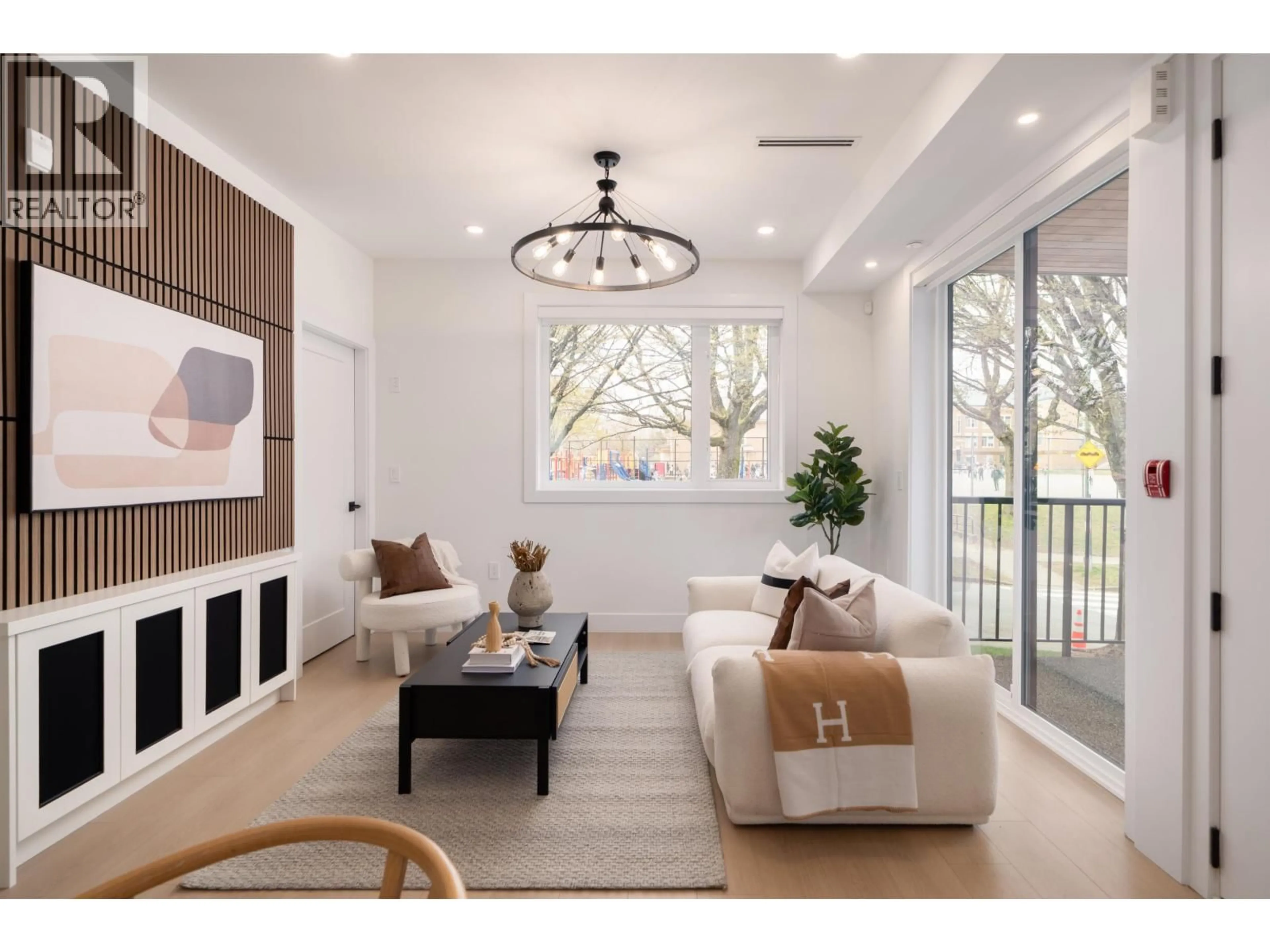 Living room with furniture, wood/laminate floor for 2612 HORLEY STREET, Vancouver British Columbia V5R3L6