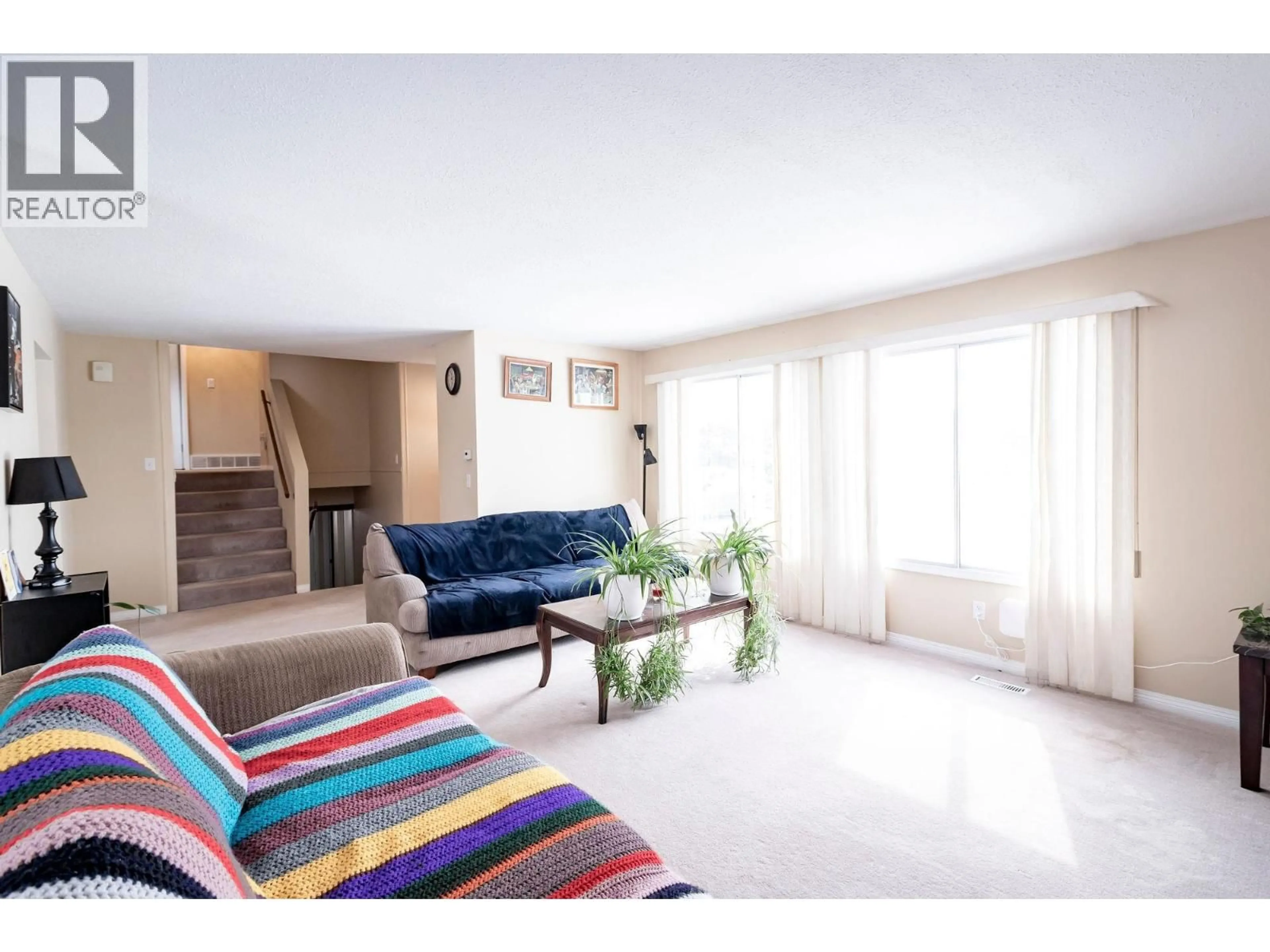 Living room with furniture, unknown for 9128 97 AVENUE, Fort St. John British Columbia V1J5E3