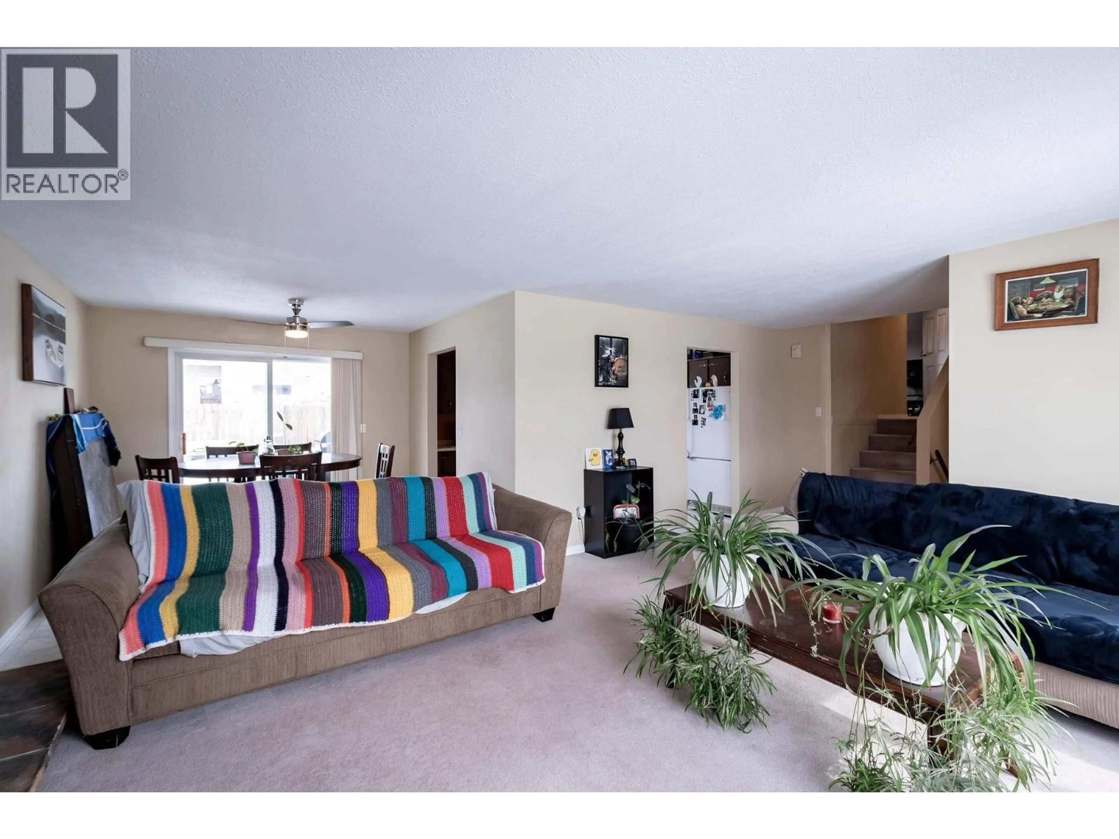 Living room with furniture, carpet floor for 9128 97 AVENUE, Fort St. John British Columbia V1J5E3