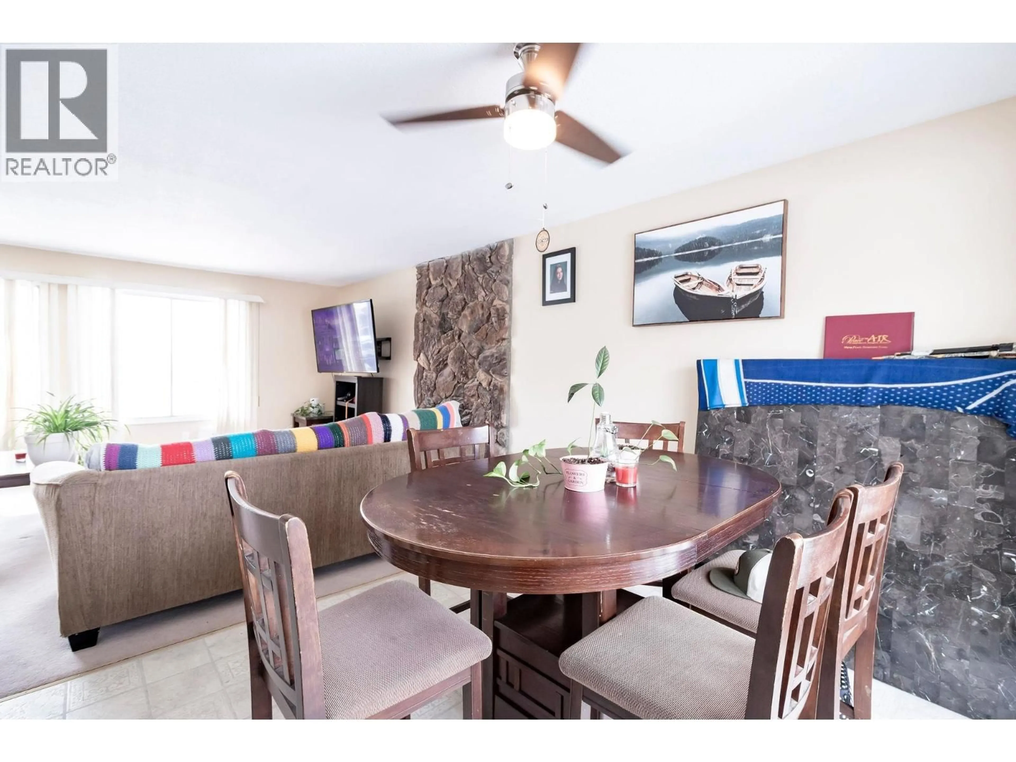 Dining room, wood/laminate floor for 9128 97 AVENUE, Fort St. John British Columbia V1J5E3