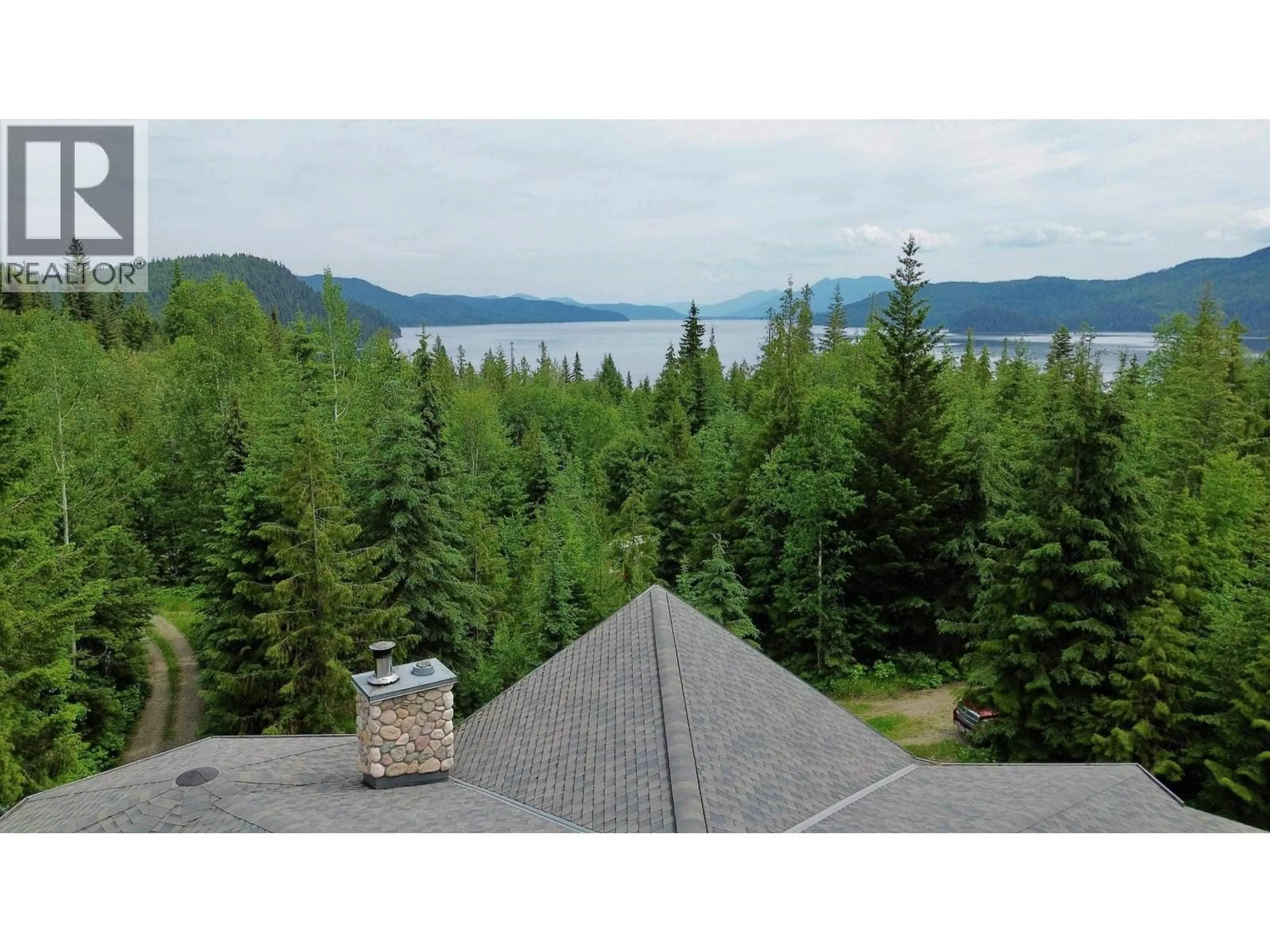 A pic from outside/outdoor area/front of a property/back of a property/a pic from drone, water/lake/river/ocean view for 3561 CANIM-HENDRIX LAKE ROAD, Canim Lake British Columbia V0K1L0