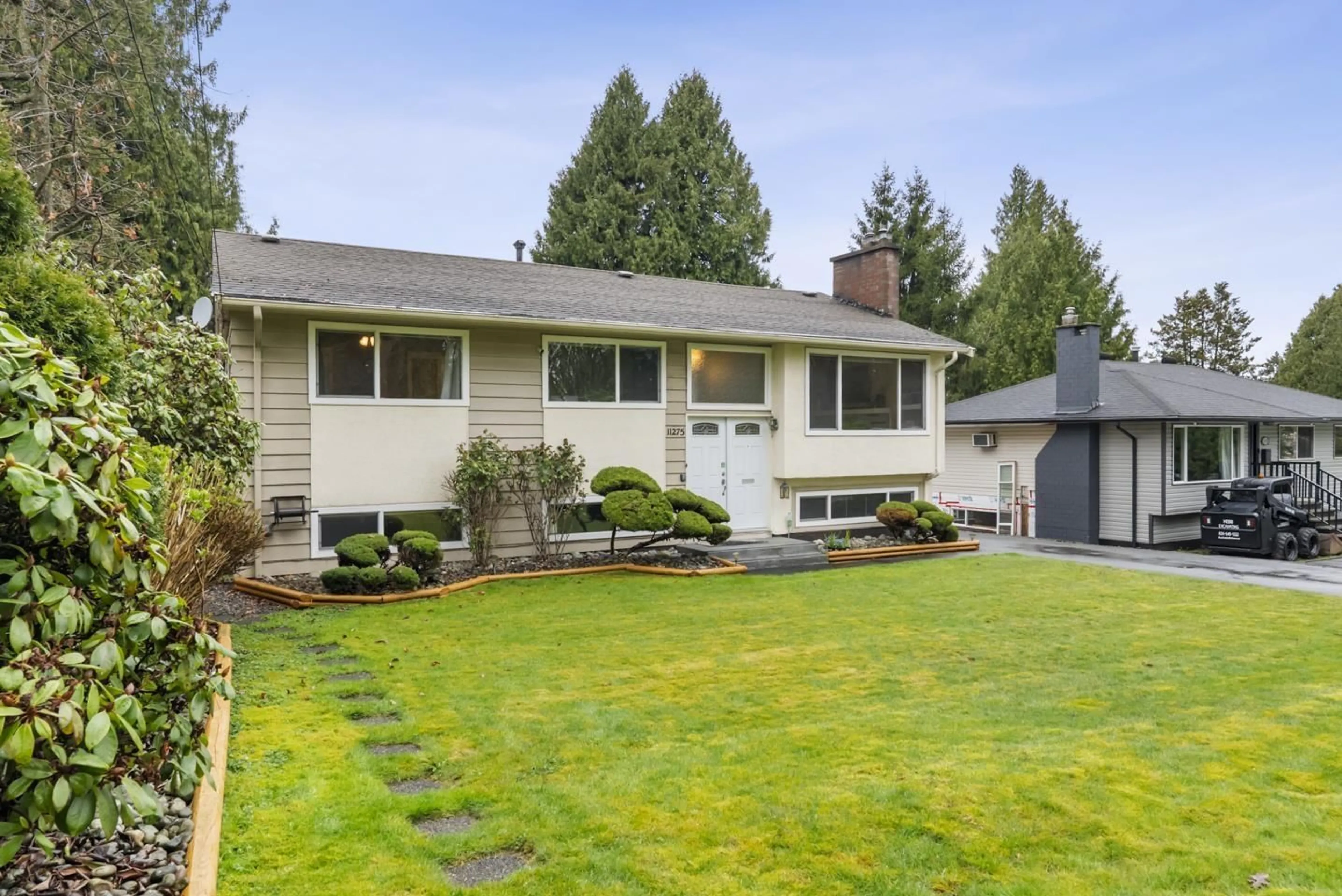 Home with vinyl exterior material, street for 11275 150 STREET, Surrey British Columbia V3R4E1