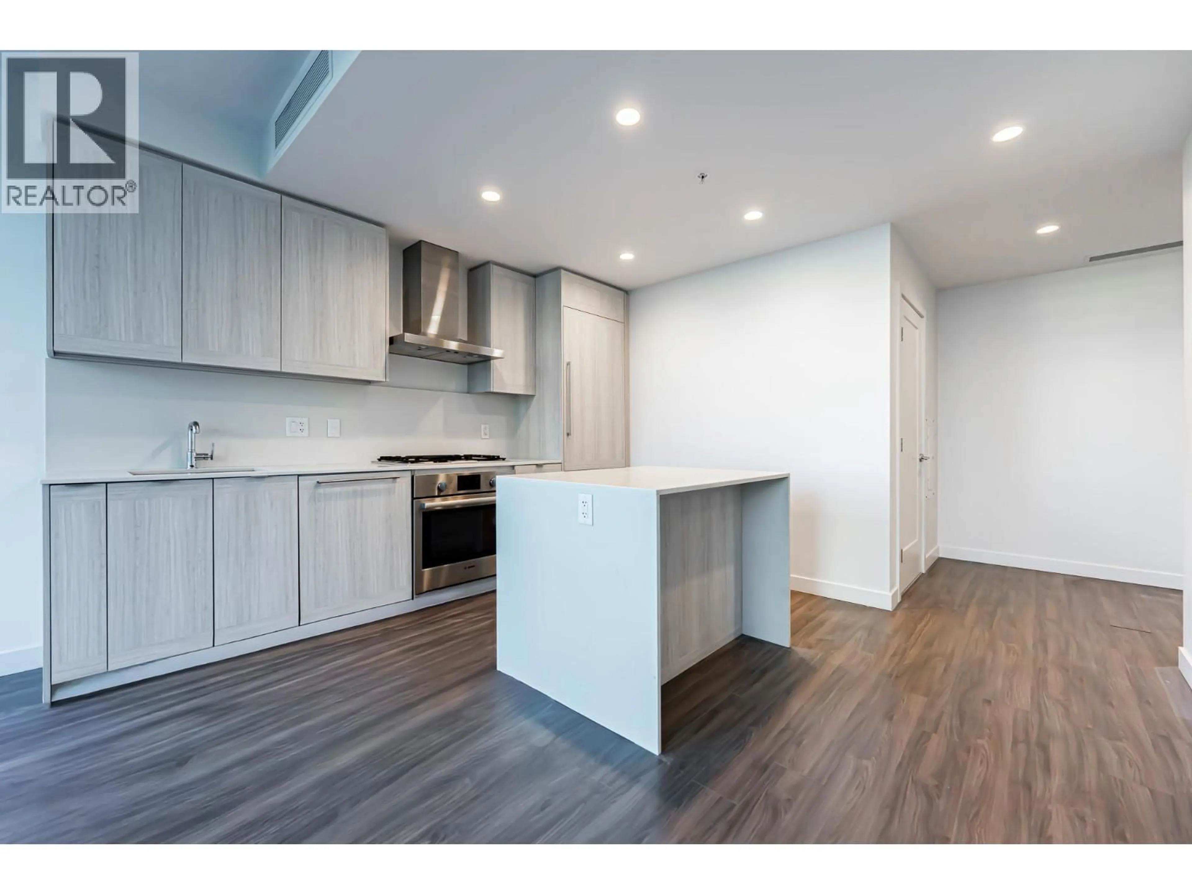 Open concept kitchen, wood/laminate floor for 507 - 2311 BETA AVENUE, Burnaby British Columbia V5C0M1