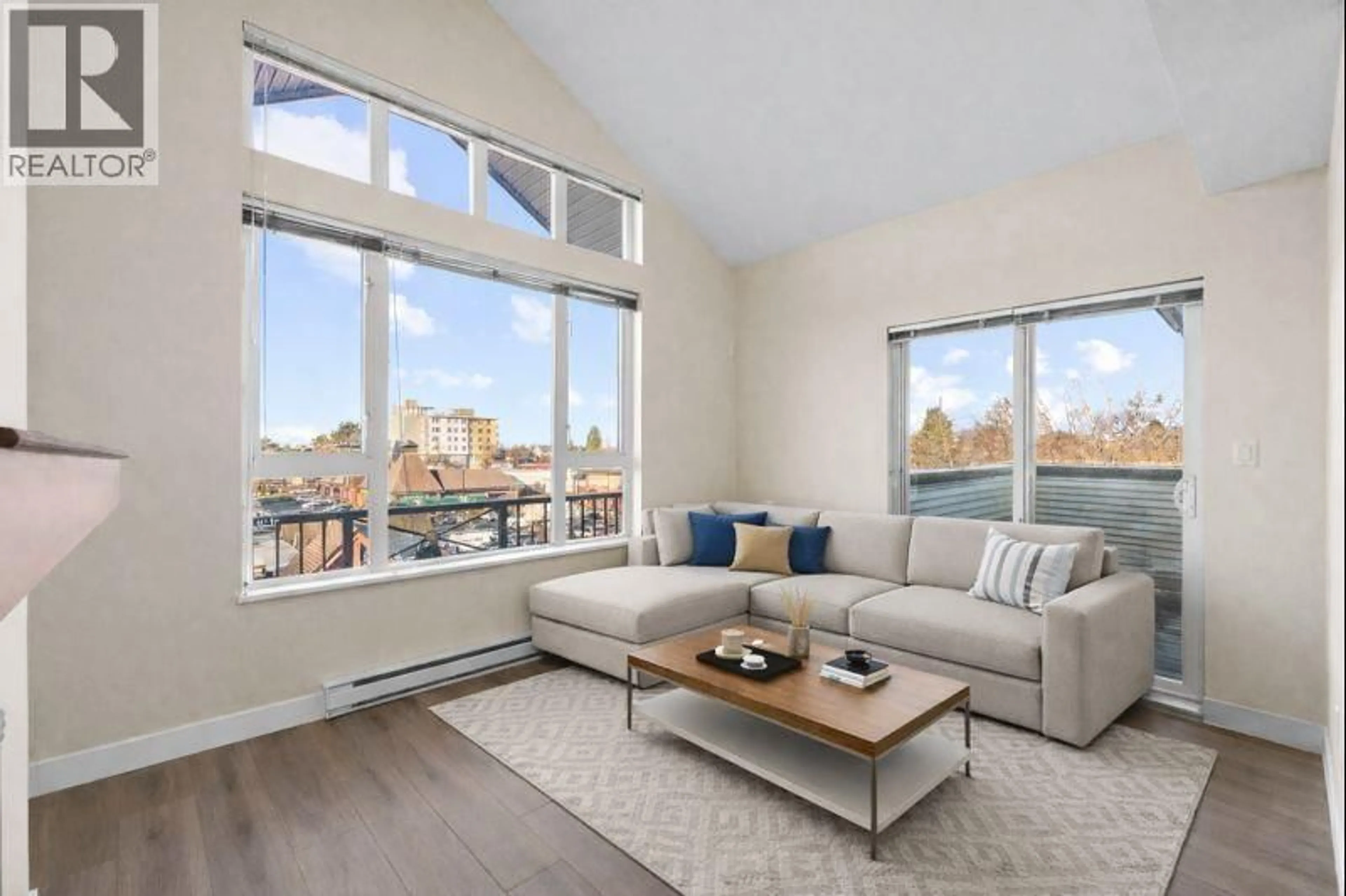 Living room with furniture, unknown for 417 - 7089 MONT ROYAL SQUARE, Vancouver British Columbia V5S4W6