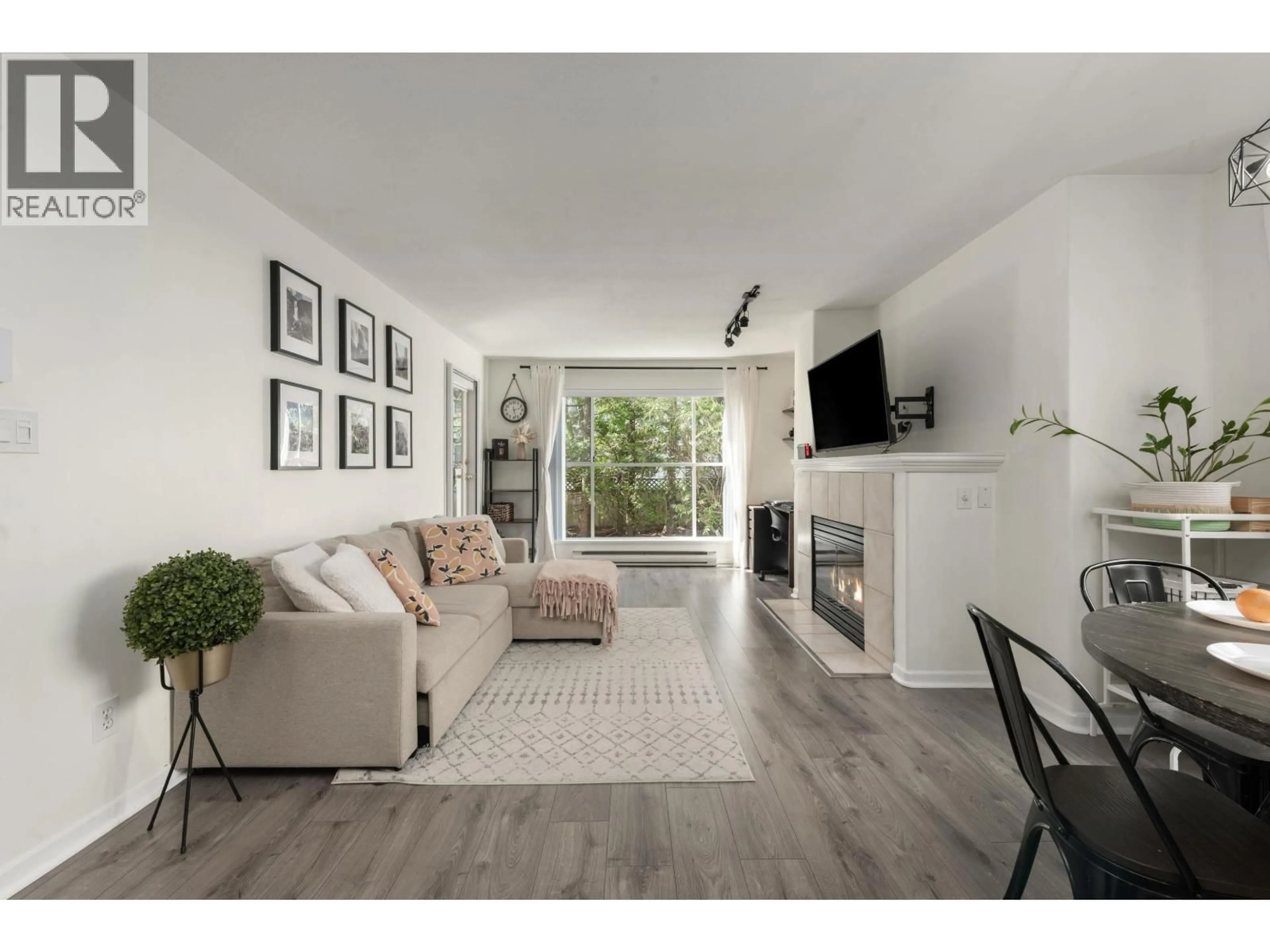 Living room with furniture, wood/laminate floor for 112 - 8880 JONES ROAD, Richmond British Columbia V6Y3Z1