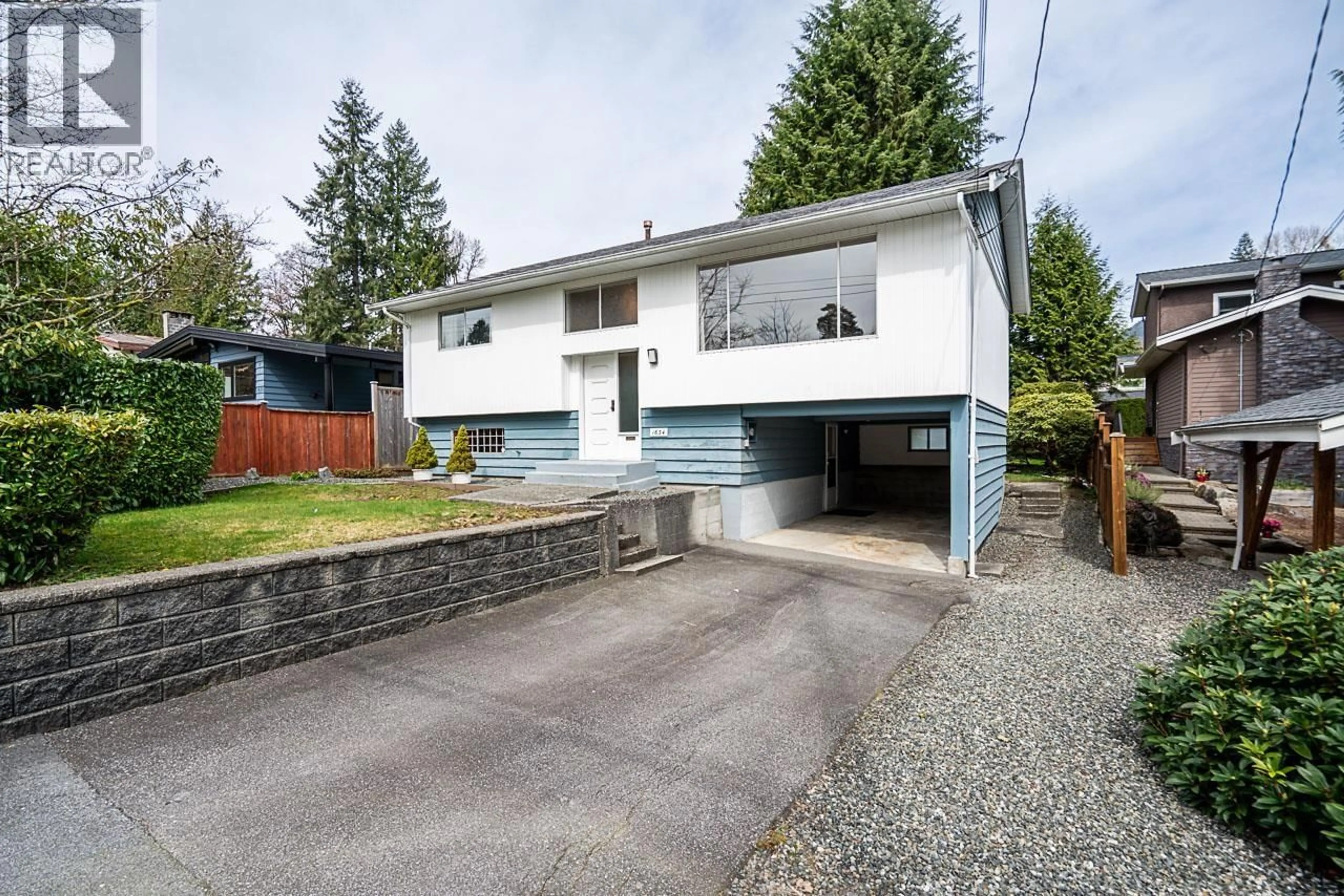 Home with vinyl exterior material, street for 1634 ROSS ROAD, North Vancouver British Columbia V7J1V4