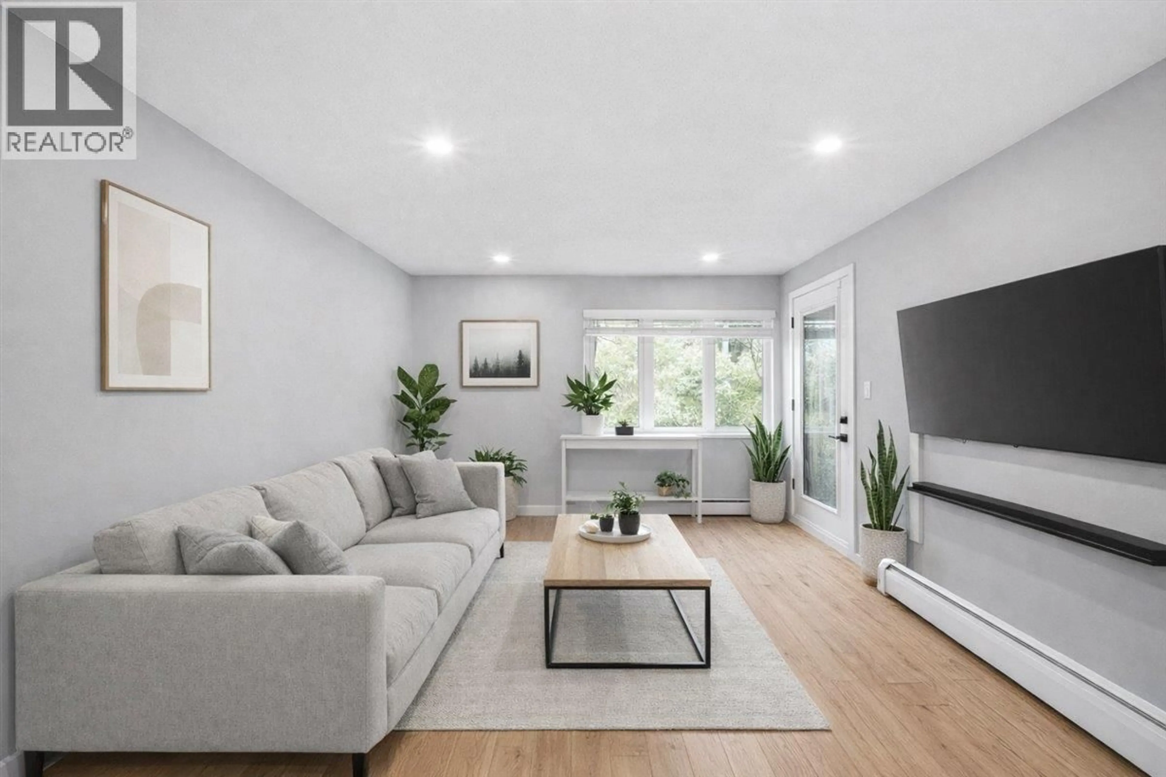 Living room with furniture, unknown for 101 - 1122 KING ALBERT AVENUE, Coquitlam British Columbia V3J1X7