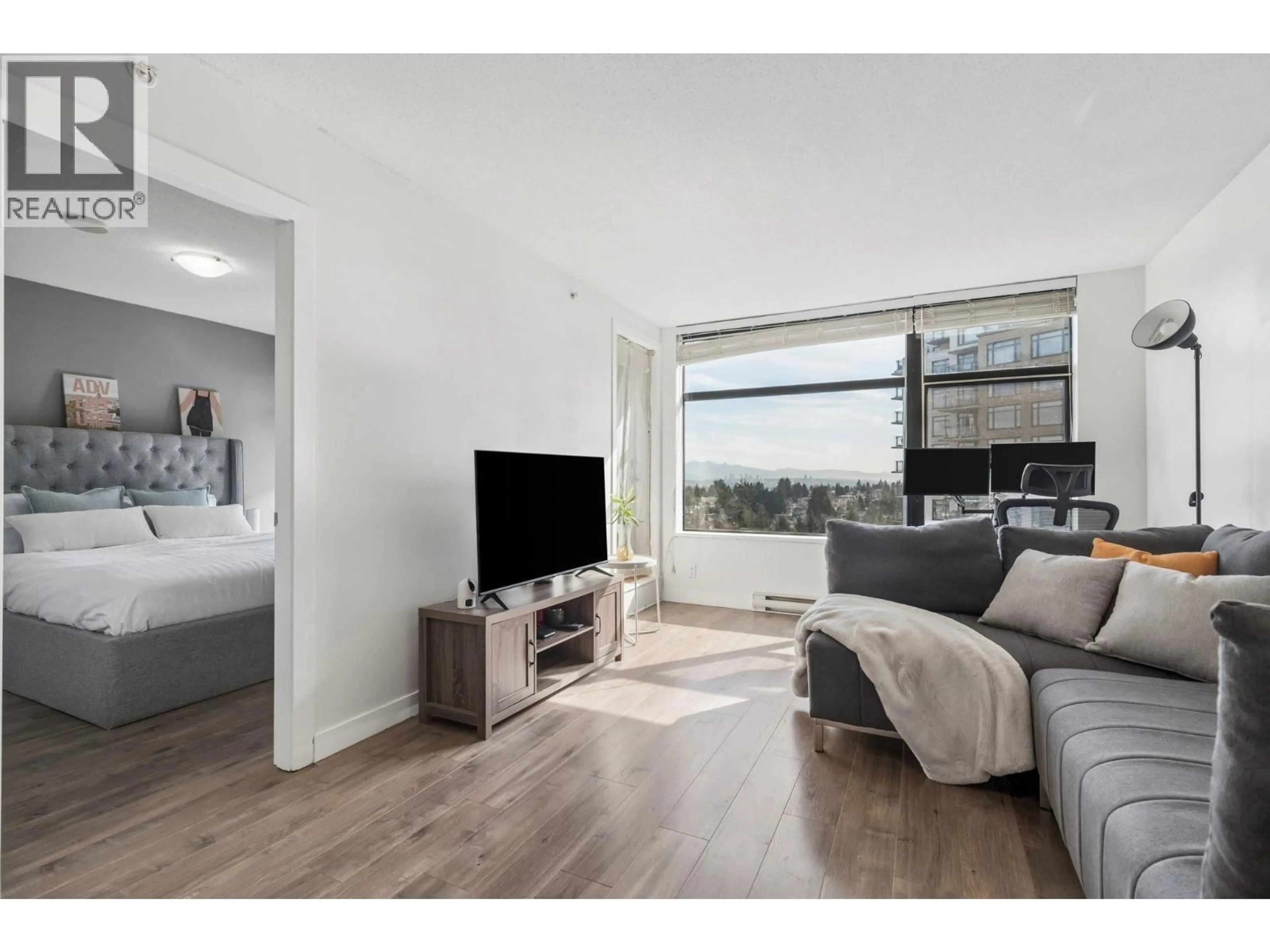 Living room with furniture, wood/laminate floor for 1610 - 5380 OBEN STREET, Vancouver British Columbia V5R6H7