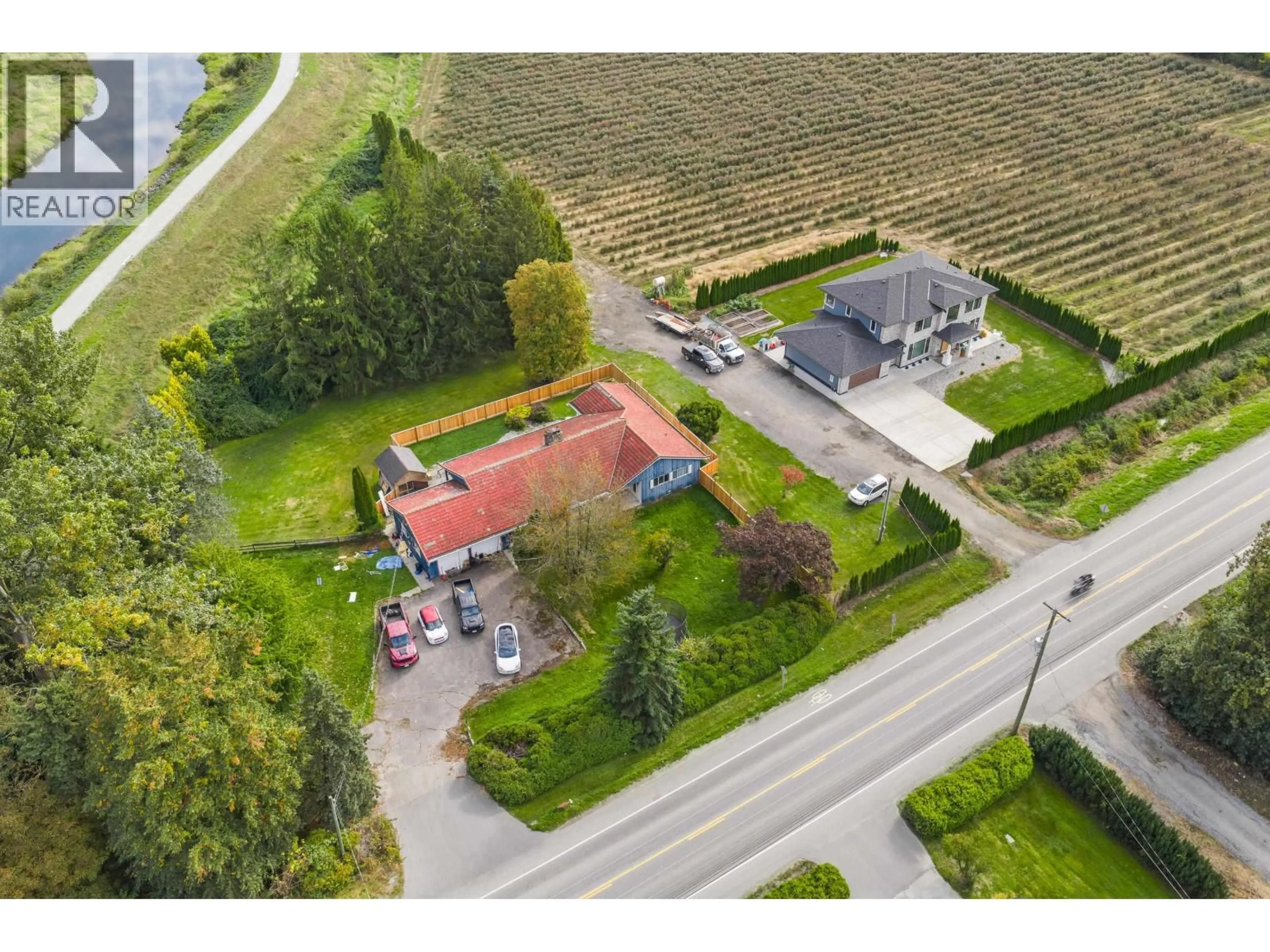 A pic from outside/outdoor area/front of a property/back of a property/a pic from drone, street for 13540 NEAVES ROAD, Pitt Meadows British Columbia V3Y0A8