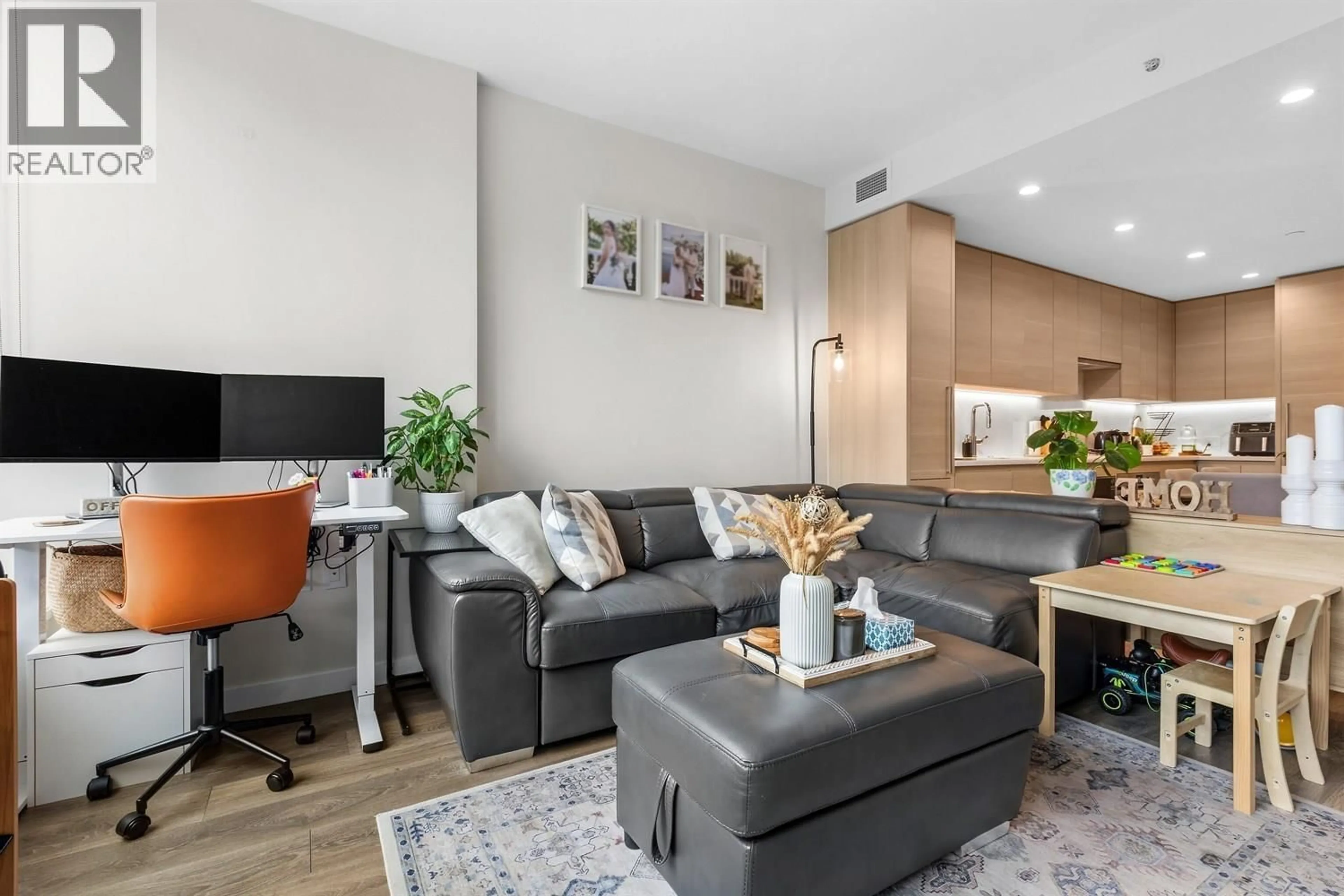 Living room with furniture, wood/laminate floor for 603 - 305 MORRISSEY ROAD, Port Moody British Columbia V3H0M3