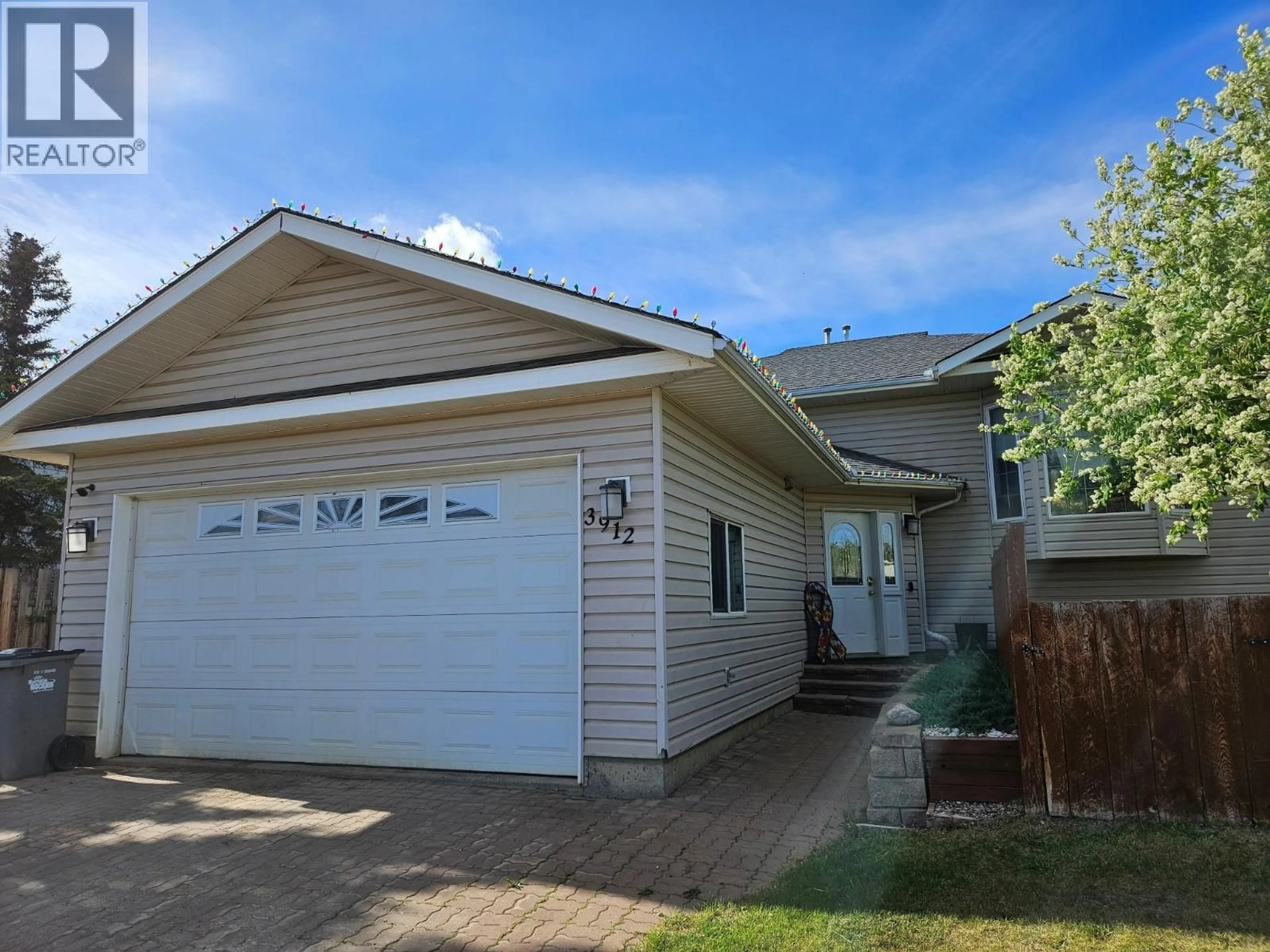 Home with vinyl exterior material, street for 3912 COTTONWOOD ROAD, Fort Nelson British Columbia V0C1R0