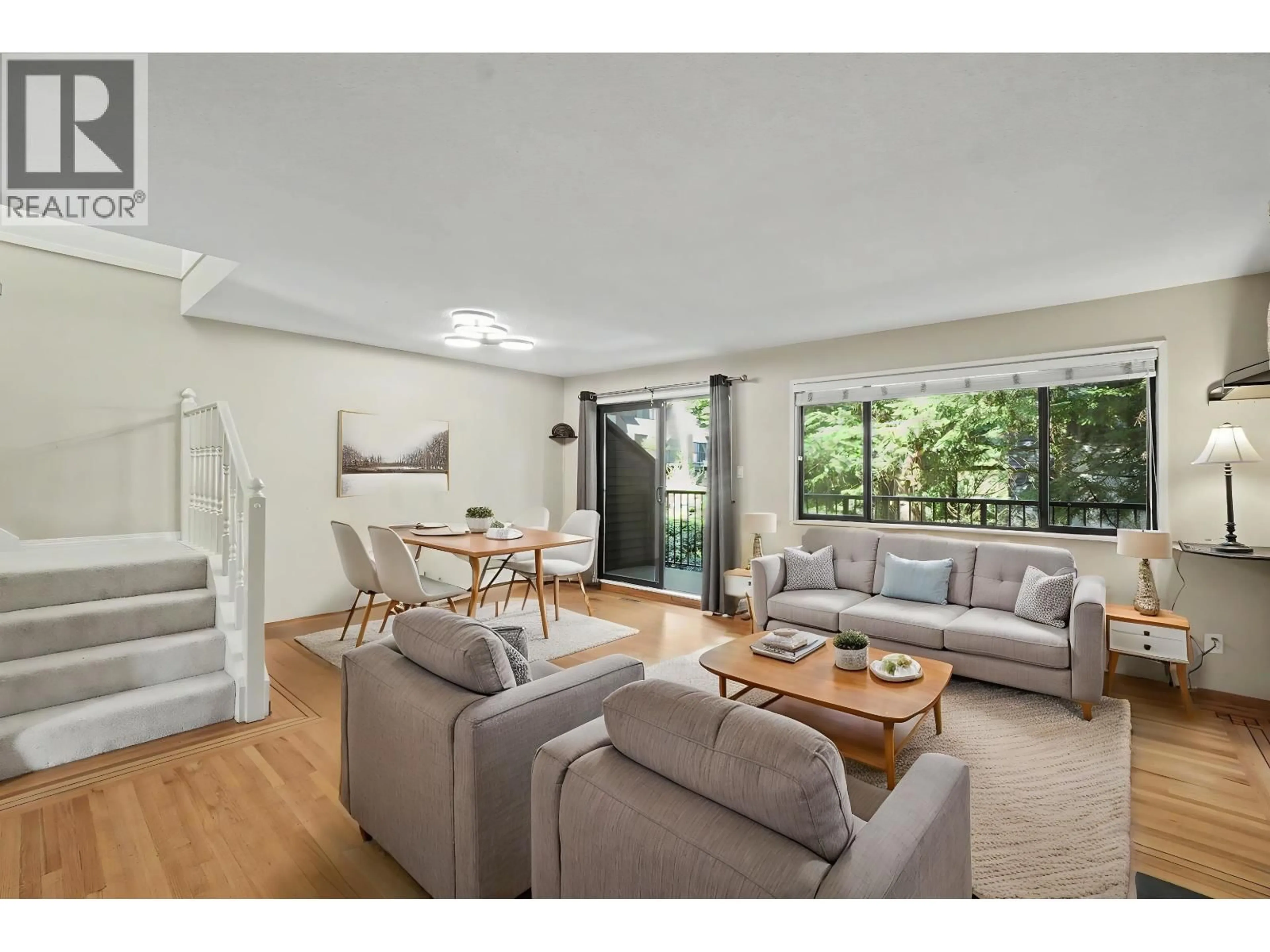 Living room with furniture, wood/laminate floor for 7305 CORONADO DRIVE, Burnaby British Columbia V5A1P9