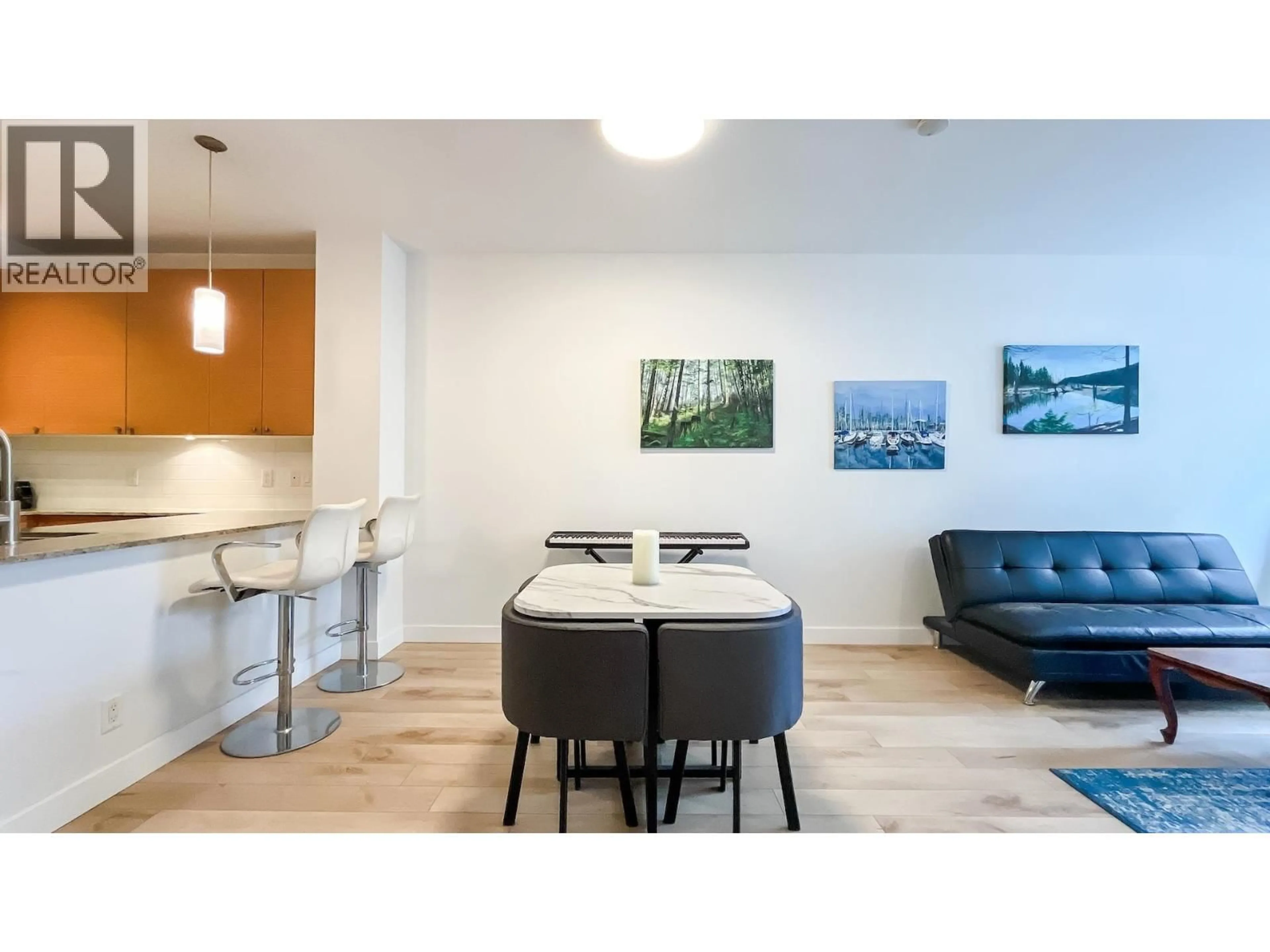 Open concept kitchen, wood/laminate floor for 217 - 101 MORRISSEY ROAD, Port Moody British Columbia V3H0E6