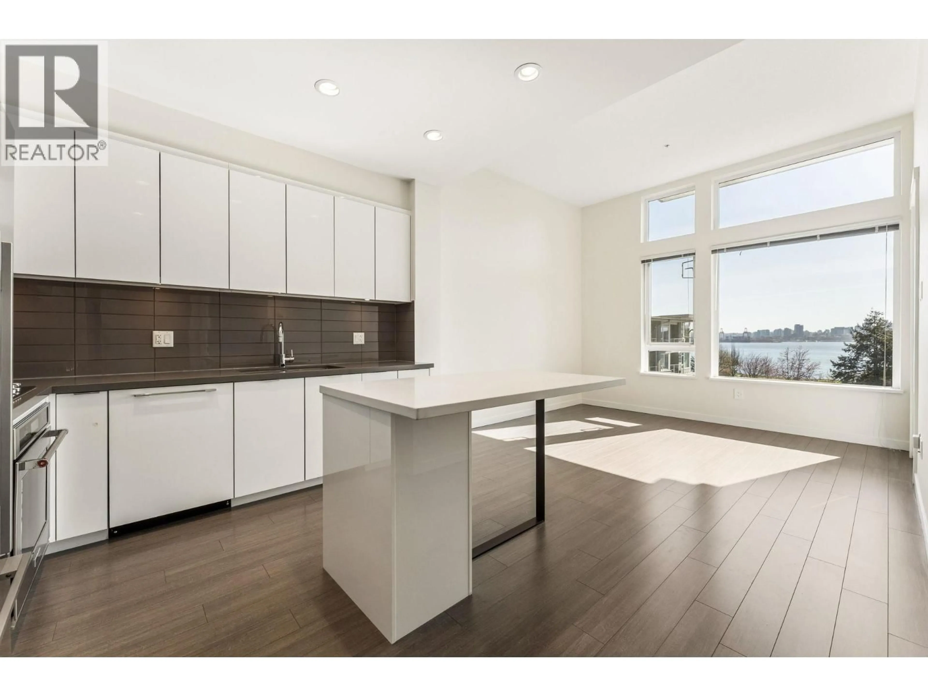 Open concept kitchen, wood/laminate floor for 502 - 255 1ST STREET, North Vancouver British Columbia V7M3G8